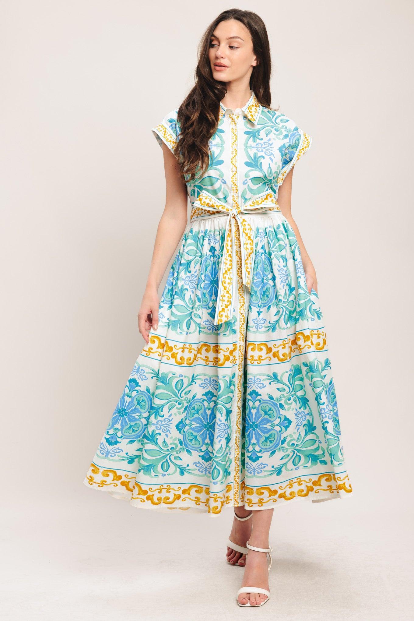A printed woven midi dress featuring collar, short sleeve, front button down, self sash tie and full skirt
Details:
Self: 100% Cotton
Size & Fit
-Model is 5`8" And Wearing Size Small
-Measurements Taken From Size Small
-Approx. Length: 51"