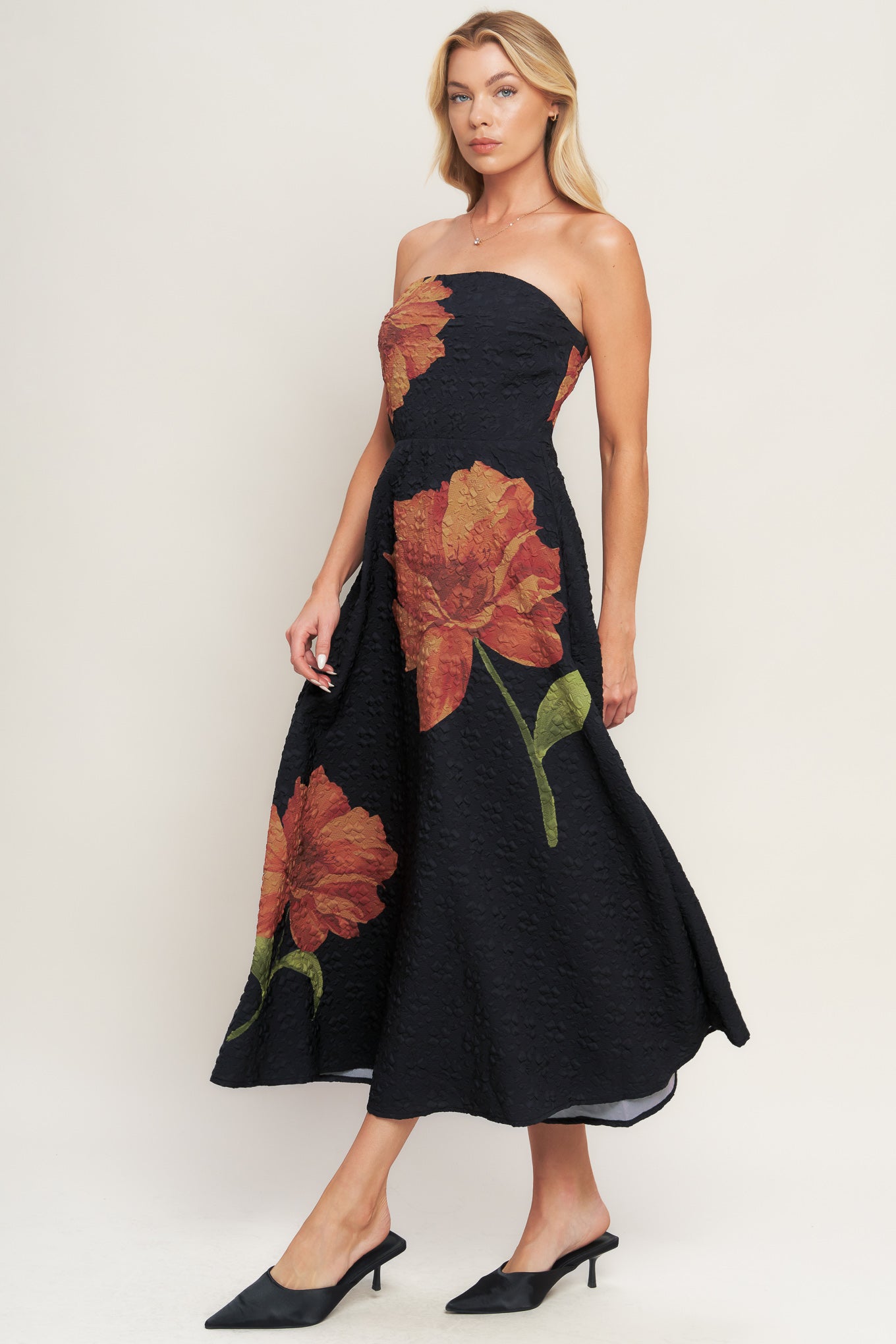A printed textured woven midi dress featuring strapless, circle skirt and back zipper closure