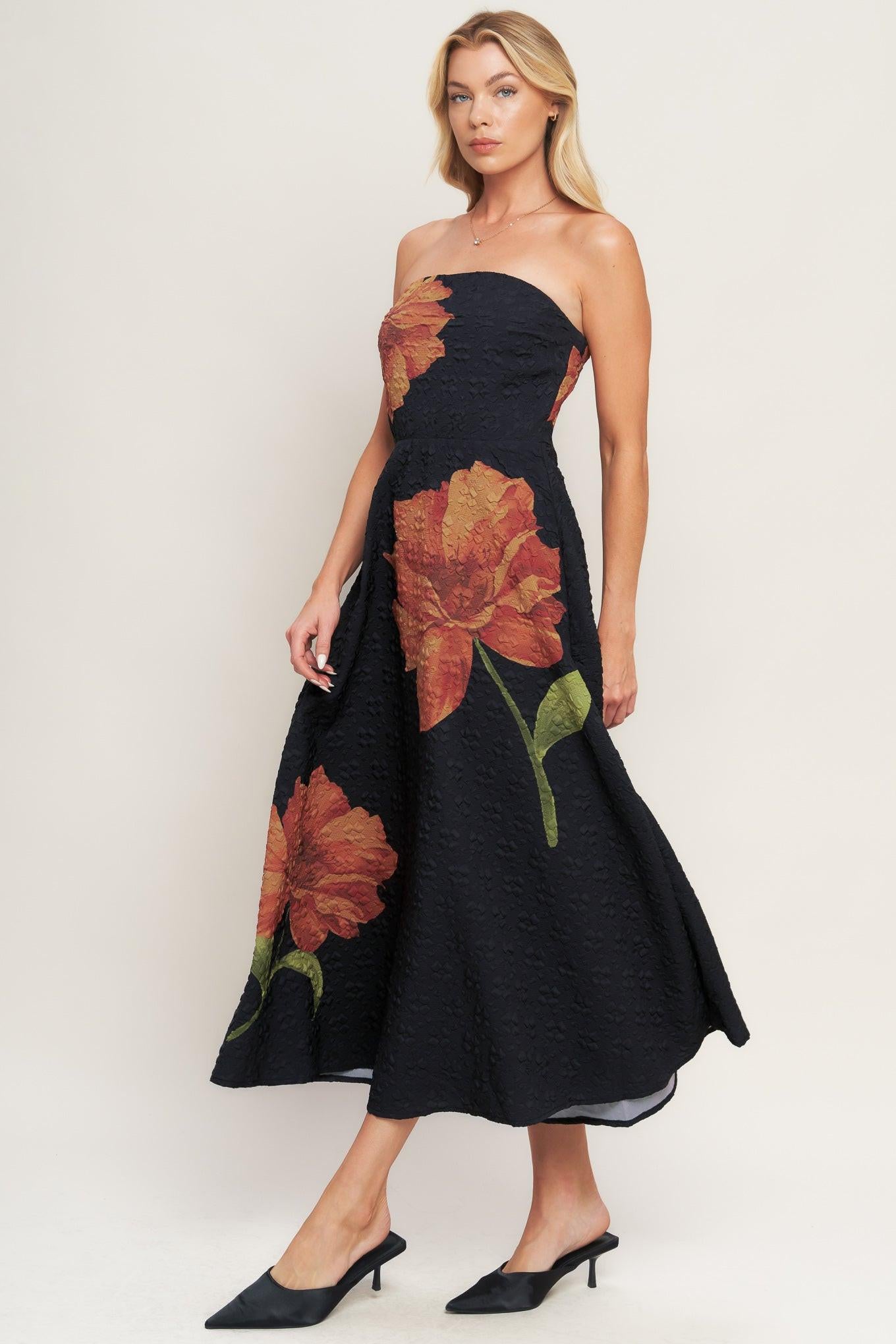 A printed textured woven midi dress featuring strapless, circle skirt and back zipper closure