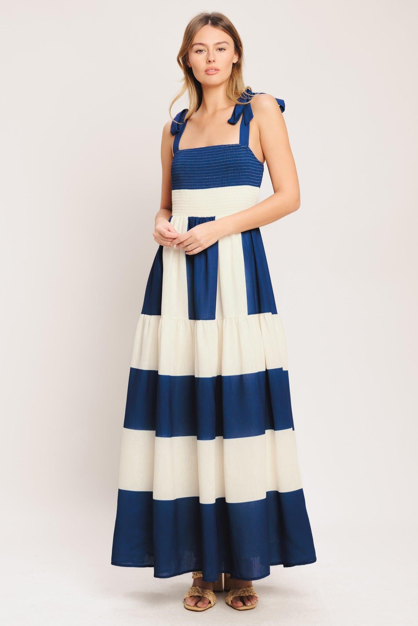 A printed woven maxi dress featuring straight neckline, shoulder ties, smocked bodice and tiered skirt
Details:
Self: 100% Polyester
Lining: 100% Polyester
Size & Fit
-Model is 5`8" And Wearing Size Small
-Measurements Taken From Size Small
-Approx. Length: 59"
