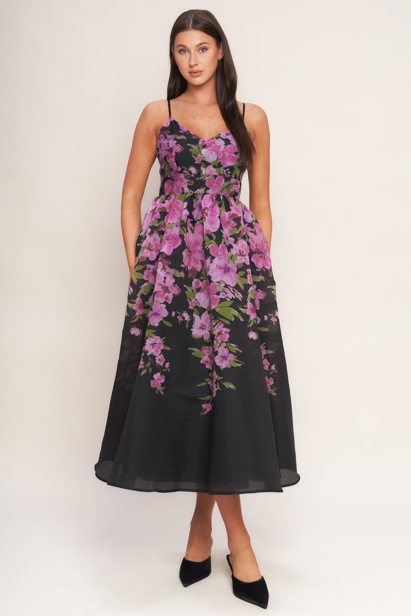 A printed woven midi dress featuring cami top, wide waist band, full skirt and back zipper closure