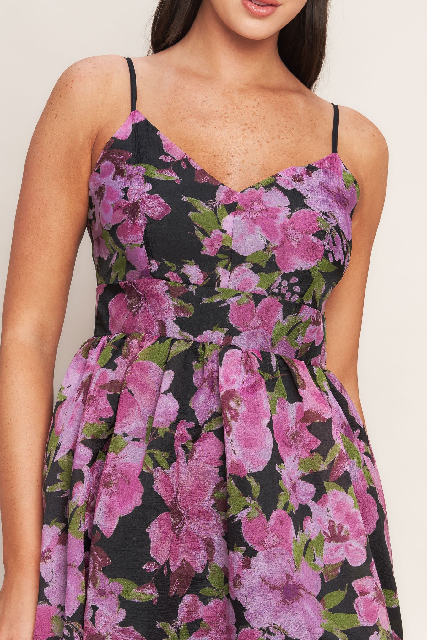 A printed woven midi dress featuring cami top, wide waist band, full skirt and back zipper closure