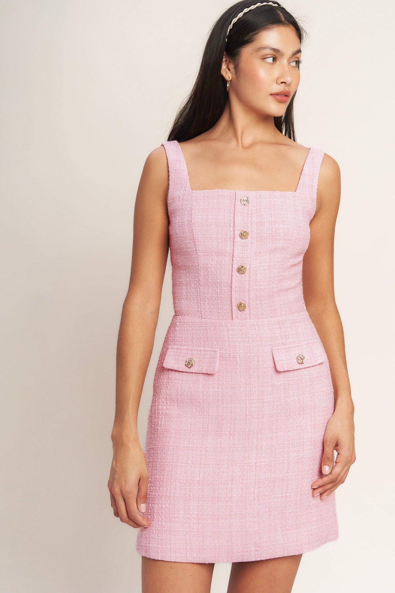 A woven tweed mini dress featuring square neckline, sleeveless, front button detail and back zipper closure
Details:
Self : 100% Polyester
Lining: 100% Polyester
Size & Fit
- Model is 5`8" And Wearing Size Small
- Measurements Taken From Size Small
- Approx. Length: 35" Flying Tomato