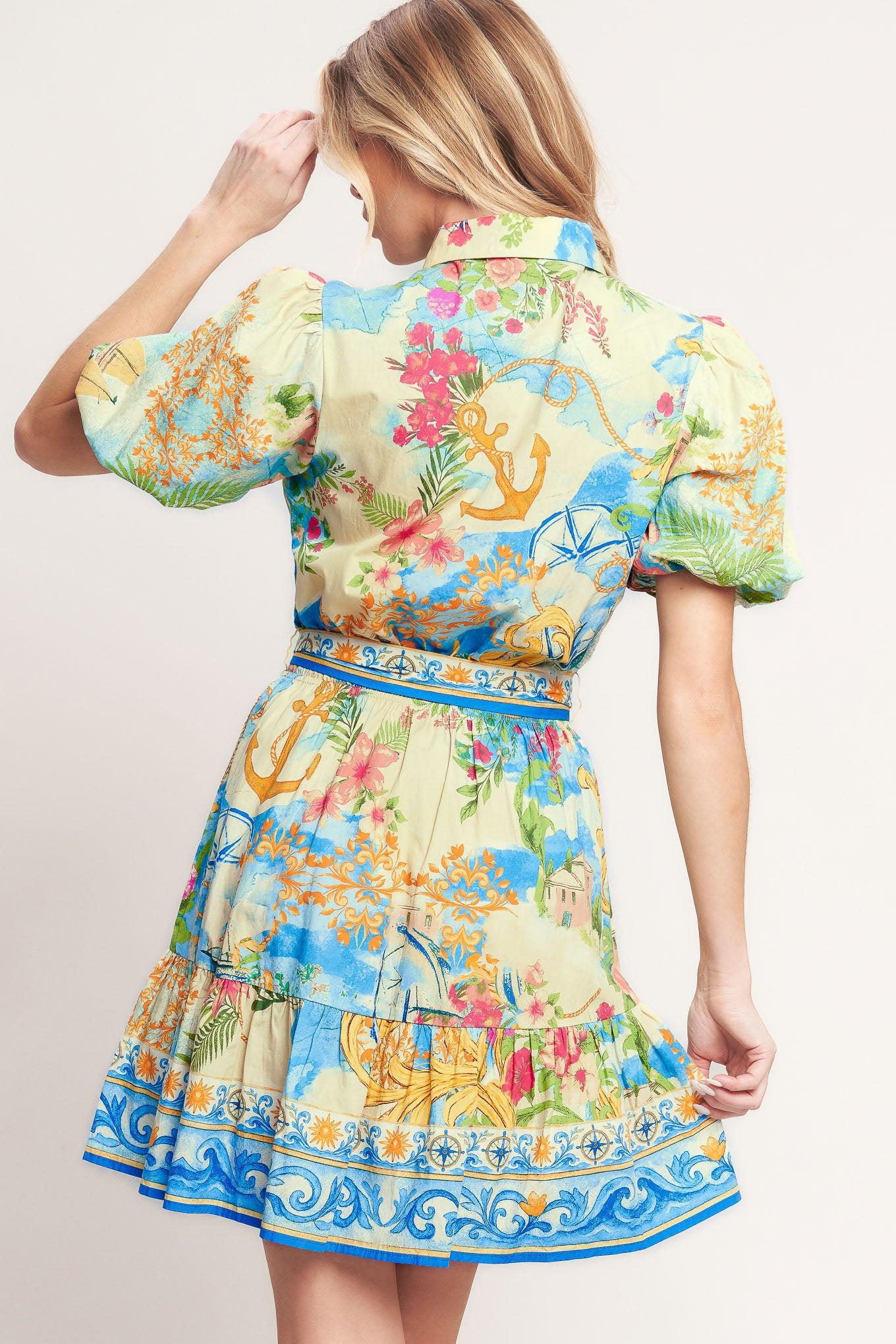 A printed woven mini dress featuring collar, short puff sleeve, front button down, elasticized waist with self sash tie and ruffle hem
Details:
Self: 100% Cotton
Size & Fit
-Model is 5`8" And Wearing Size Small
-Measurements Taken From Size Small
-Approx. Length: 36"