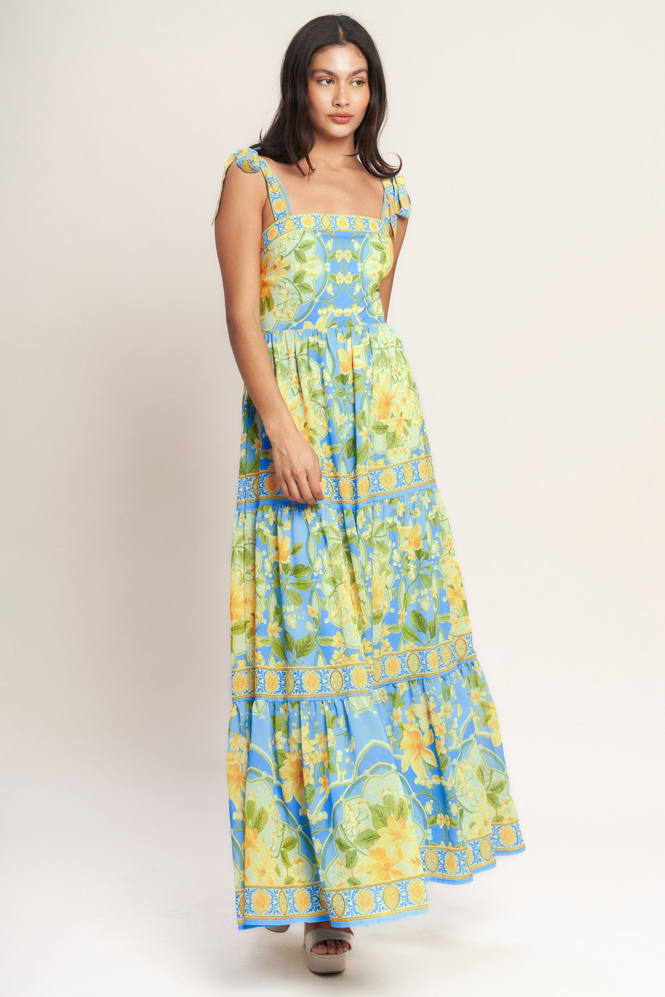 A printed woven maxi dress featuring straight neckline, shoulder ties, tiered skirt and back zipper closure
Details:
Self : 100% Polyester
Lining : 100% Polyester
Size & Fit
- Model is 5`8" And Wearing Size Small
- Measurements Taken From Size Small
- Approx. Length: 61" Flying Tomato