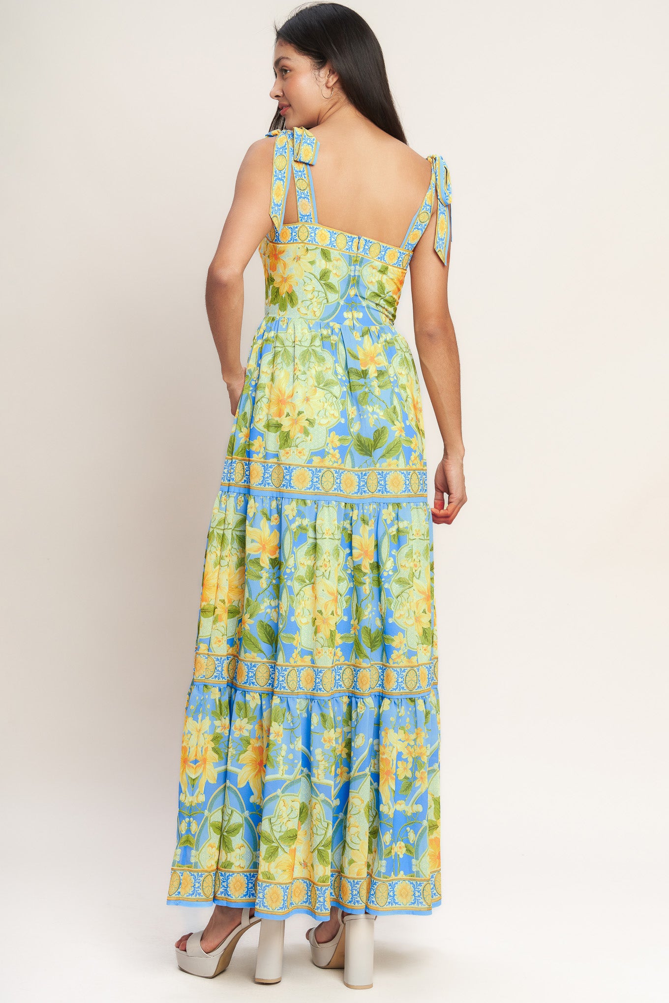 A printed woven maxi dress featuring straight neckline, shoulder ties, tiered skirt and back zipper closure
Details:
Self : 100% Polyester
Lining : 100% Polyester
Size & Fit
- Model is 5`8" And Wearing Size Small
- Measurements Taken From Size Small
- Approx. Length: 61" Flying Tomato