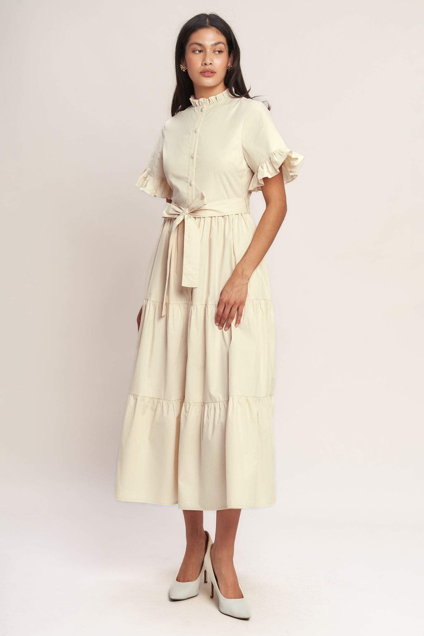 A solid woven midi dress featuring high ruffle neckline, short sleeve with ruffled edge, front button down, self sash tie and tiered skirt
Details:
Self : 100% Cotton
Lining : 100% Polyester
Size & Fit
- Model is 5`8" And Wearing Size Small
- Measurements Taken From Size Small
- Approx. Length: 52" FYING TOMATO