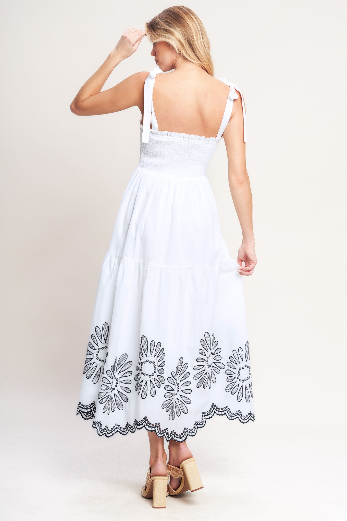 A solid woven midi dress featuring contrasting ruffle edge, shoulder tie and embroidered skirt
Details:
Self: 100% Cotton
Lining: 100% Polyester
Size & Fit
-Model is 5`8" And Wearing Size Small
-Measurements Taken From Size Small
-Approx. Length: 50"