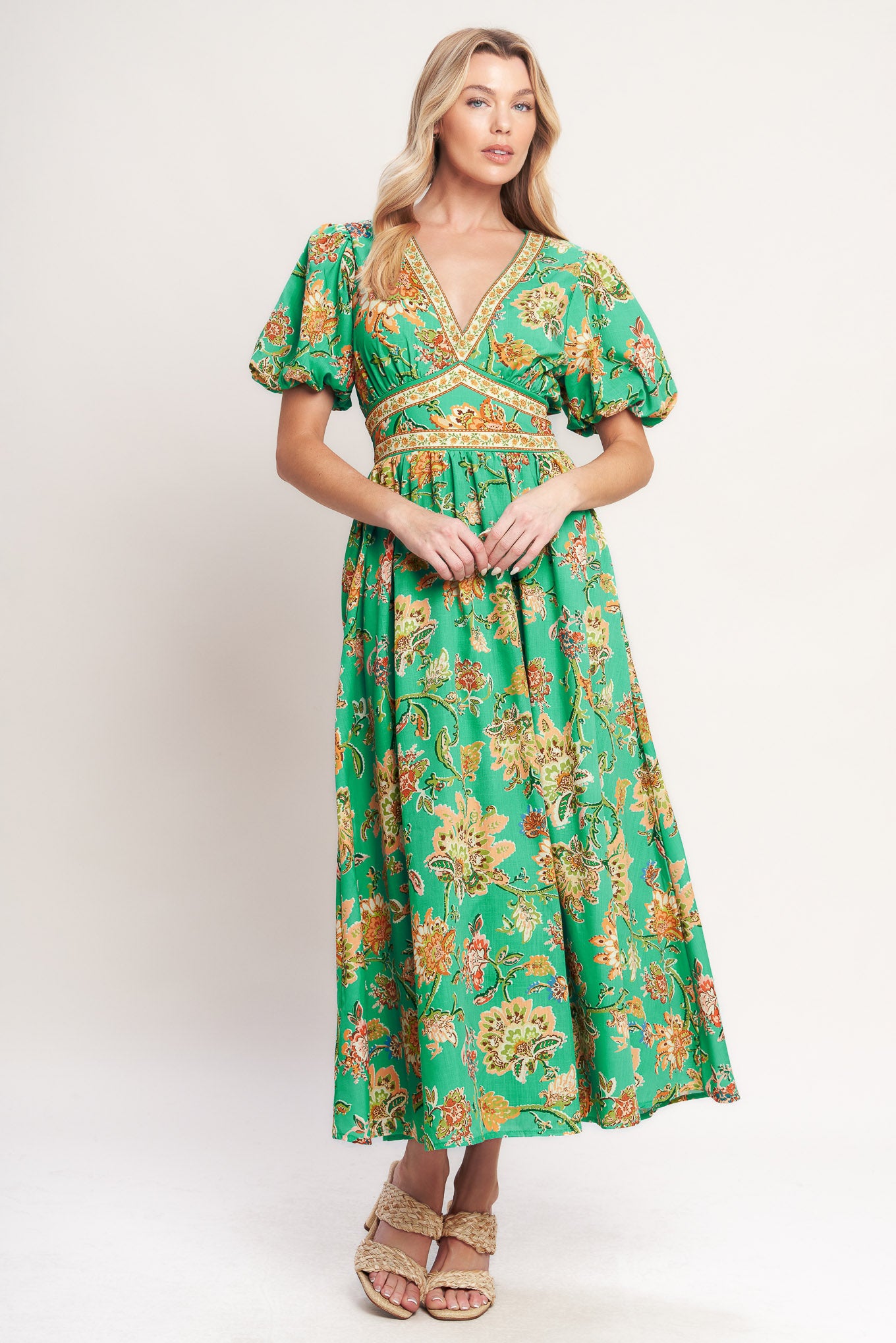 A printed woven midi dress featuring V neckline, short puff sleeve, waist yoke, full skirt and smocked back waistband
Details:
Self: 100% Polyester
Lining: 100% Polyester
Size & Fit
-Model is 5`8" And Wearing Size Small
-Measurements Taken From Size Small
-Approx. Length: 53"