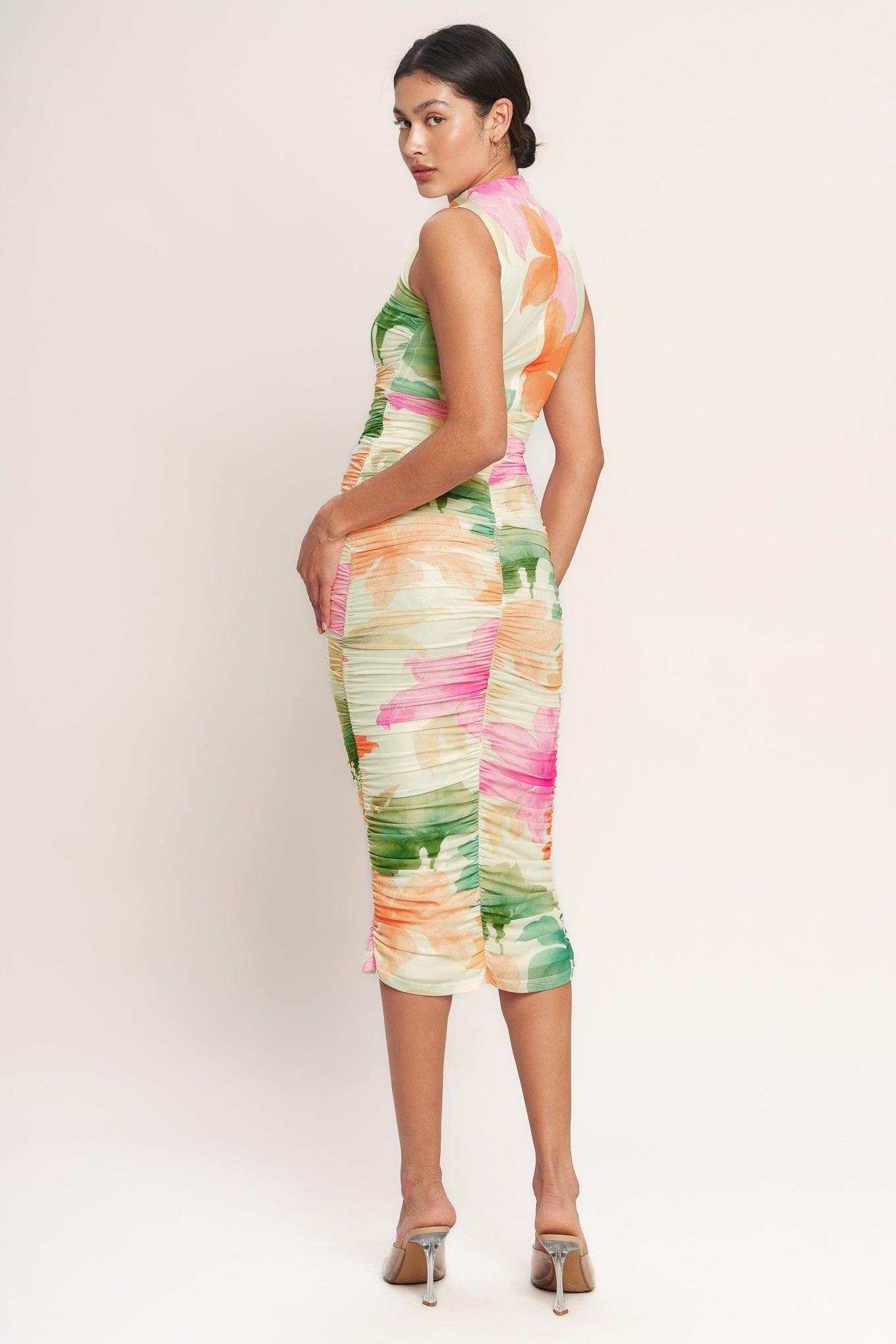 A printed power mesh midi dress featuring tubular neckline, sleeveless, shirred side, body contouring and back zipper closure
Details:
Self : 95% Polyester 5% Spandex
Lining : 100% Polyester
Size & Fit
- Model is 5`8" And Wearing Size Small
- Measurements Taken From Size Small
- Approx. Length: 51" FLYING TOMATO