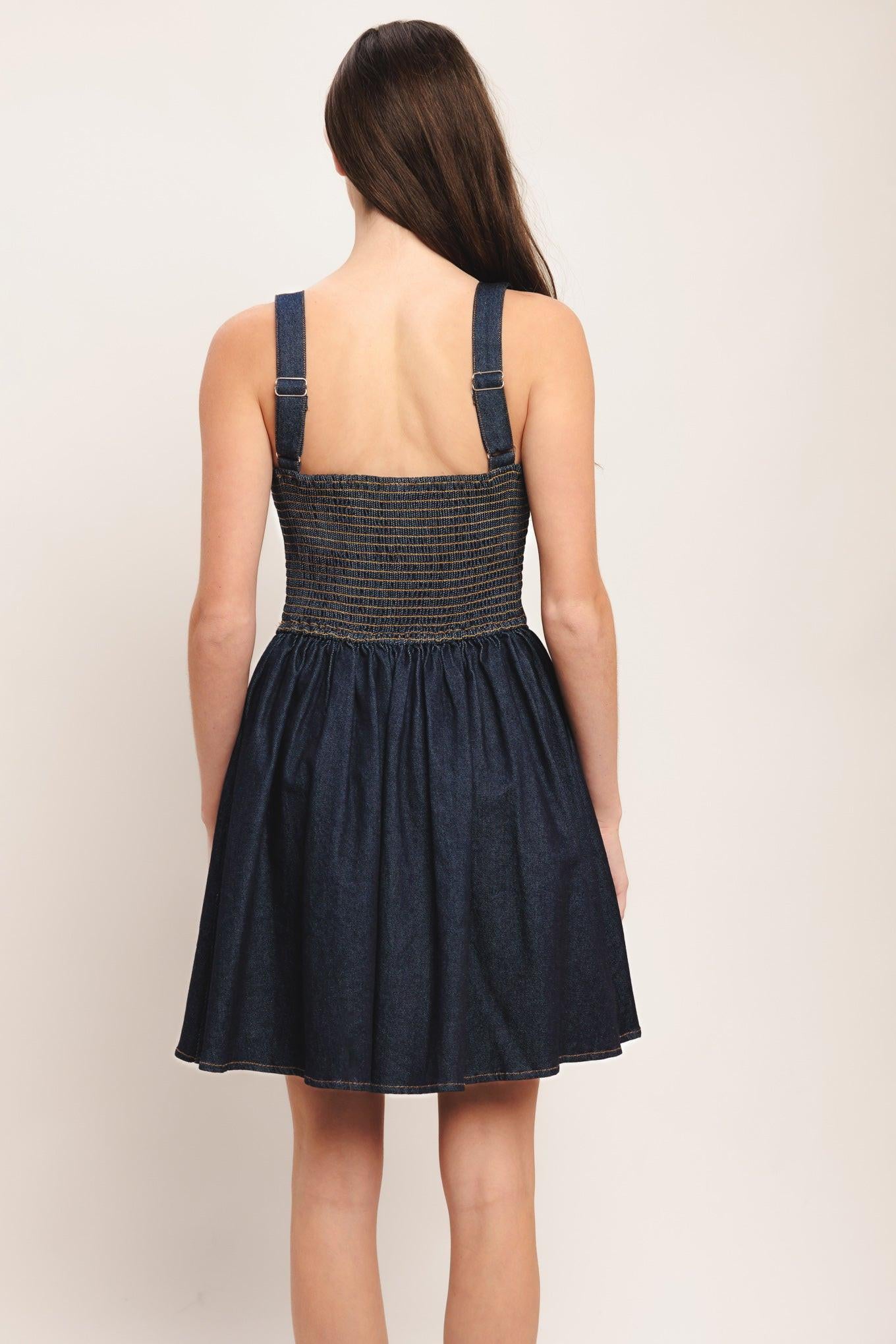 A denim mini dress featuring straight neckline, ruched bust, straps, corset waist with button detail, full skirt and smocked back bodice
Details:
Self: 98% Cotton 2% Spandex
Lining: 100% Polyester
Size & Fit
-Model is 5`8" And Wearing Size Small
-Measurements Taken From Size Small
-Approx. Length: 35"