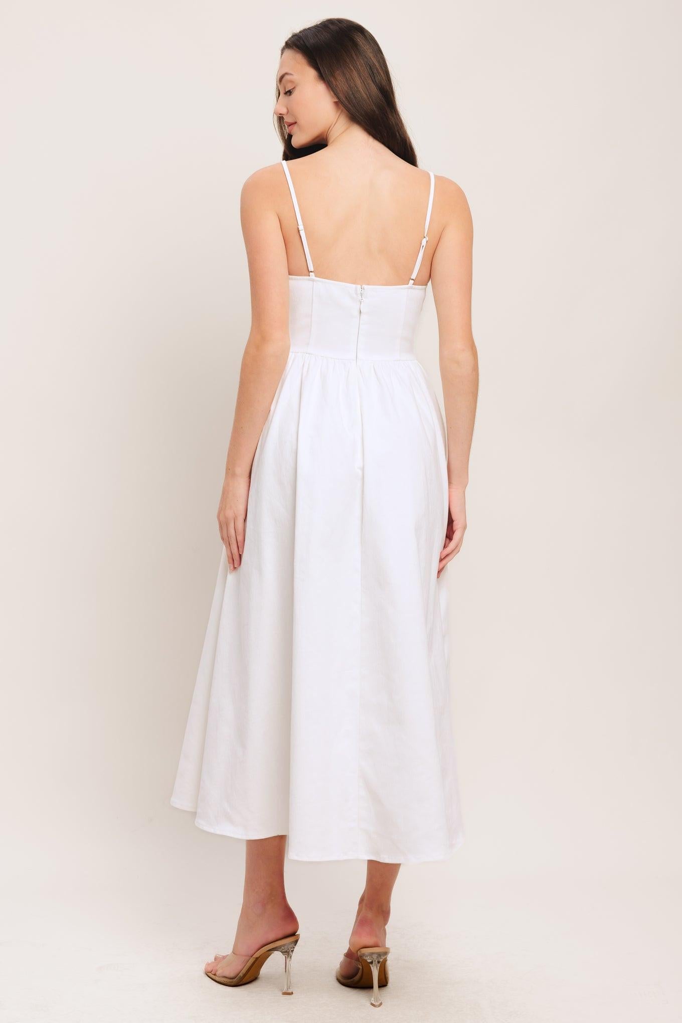 A solid woven midi dress featuring straight neckline, straps, embroidered bodice, basque waist and back zipper closure
Details:
Self: 97% Cotton 3% Spandex
Size & Fit
-Model is 5`8" And Wearing Size Small
-Measurements Taken From Size Small
-Approx. Length: 48"