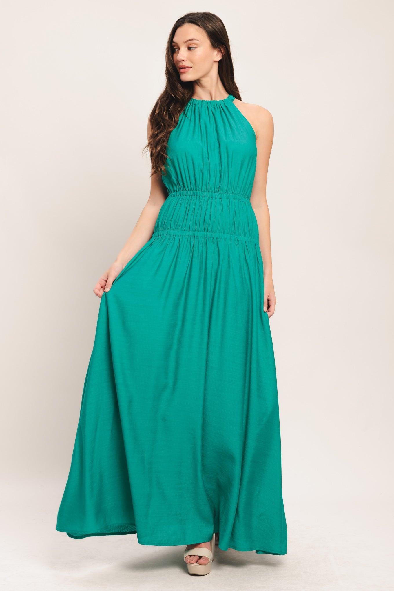 A solid woven maxi dress featuring halter neckline with back tie and elastic waist
Details:
Self: 65% Rayon 35% Nylon
Lining: 100% Polyester
Size & Fit
-Model is 5`8" And Wearing Size Small
-Measurements Taken From Size Small
-Approx. Length: 60"