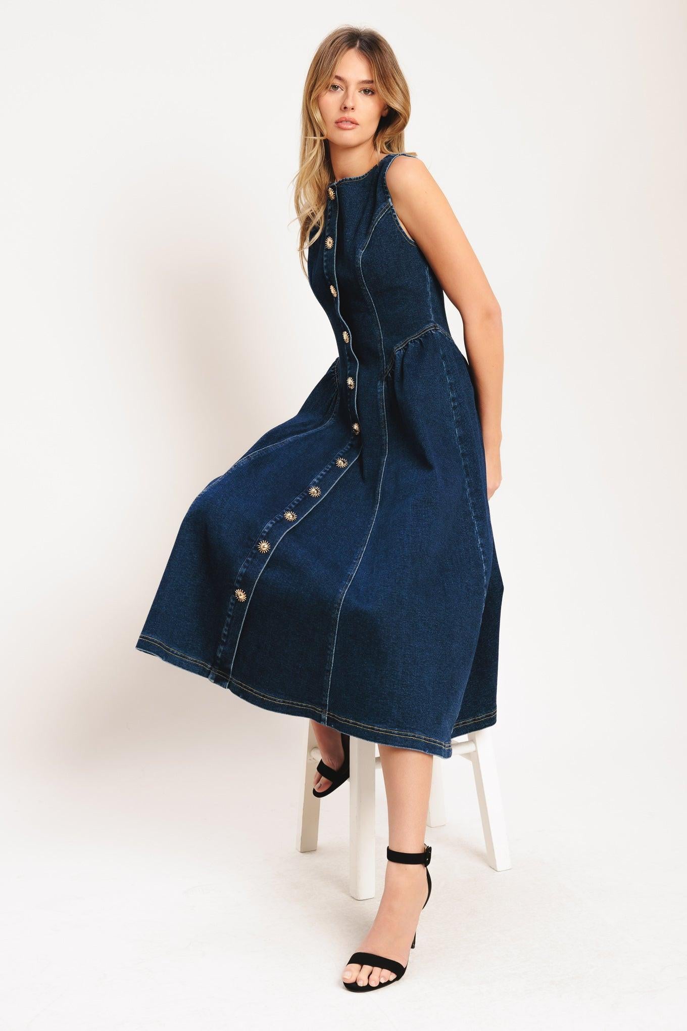 A denim midi dress featuring round neckline, sleeveless, front button down and circle skirt
Details:
Self: 55% Cotton 33% Polyester 10% Viscose 2% Spandex
Size & Fit
-Model is 5`8" And Wearing Size Small
-Measurements Taken From Size Small
-Approx. Length: 48"