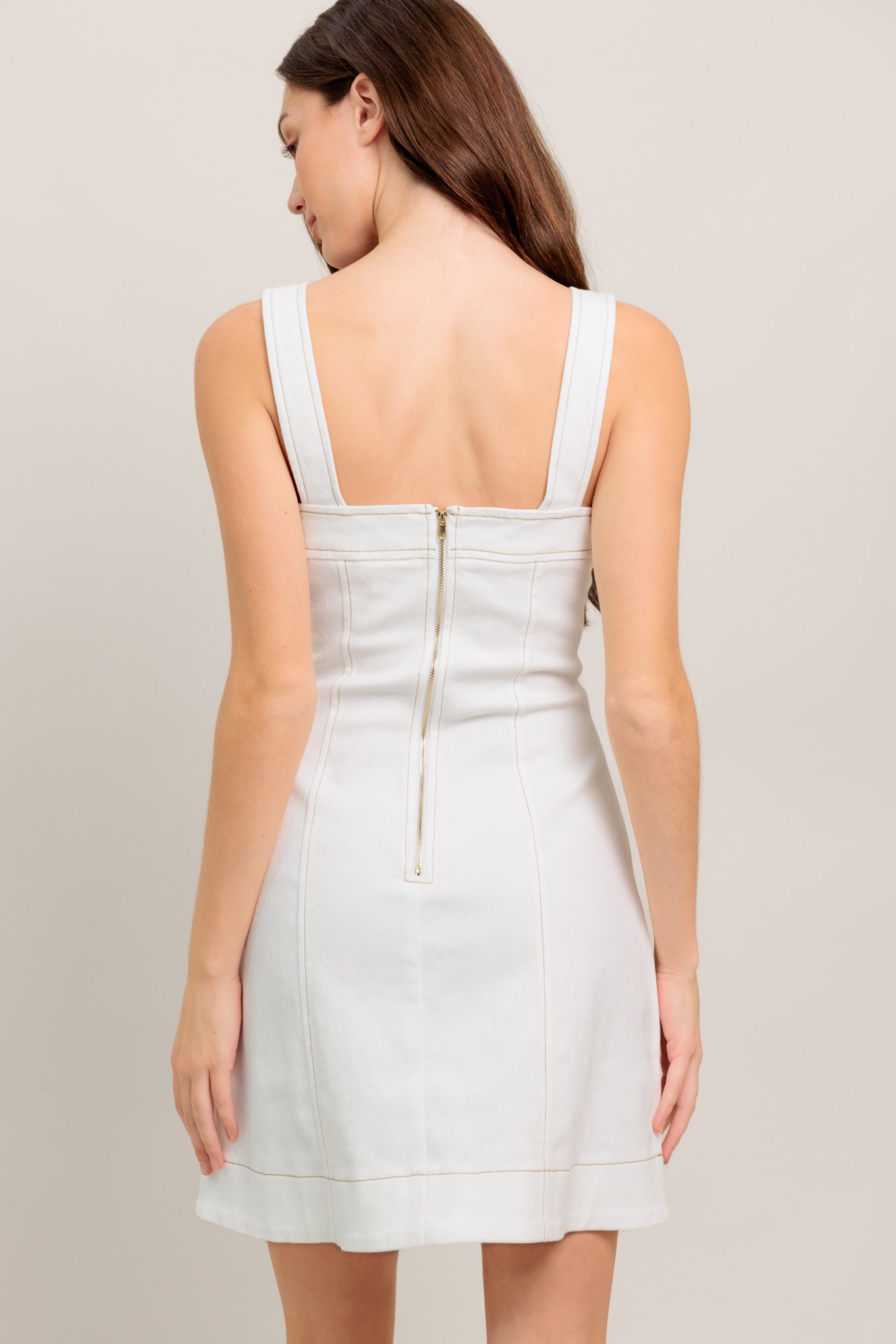 White sleeveless mini dress with wide straps, a straight neckline, and gold hardware detail
Details:
Self: 97% Cotton 3% Spandex
Size & Fit
- Model is 5`8" And Wearing Size Small
- Measurements Taken From Size Small
- Approx. Length: 34"