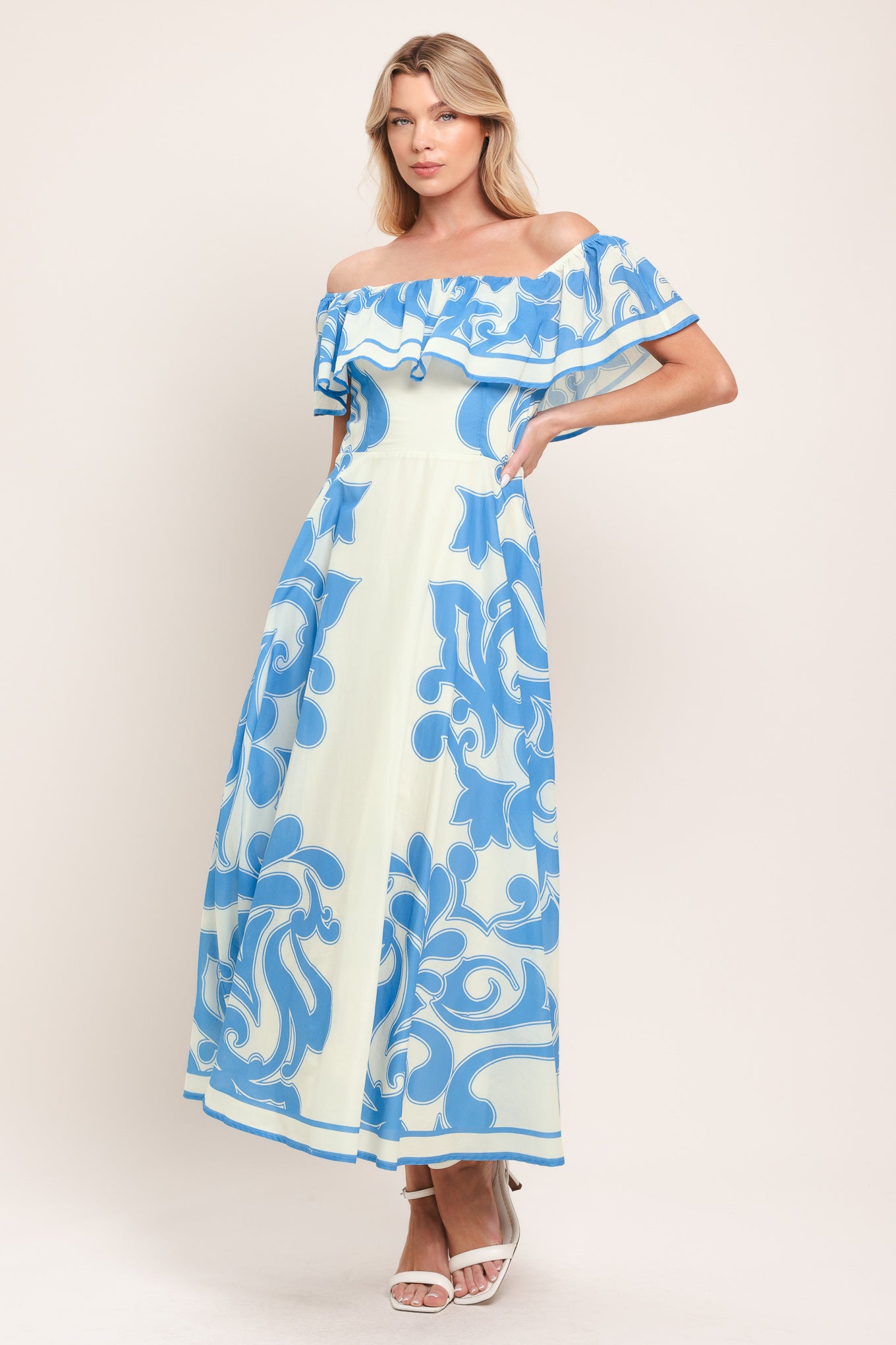 Woman wearing a blue and white patterned off the shoulder midi dress | Flying Tomato
