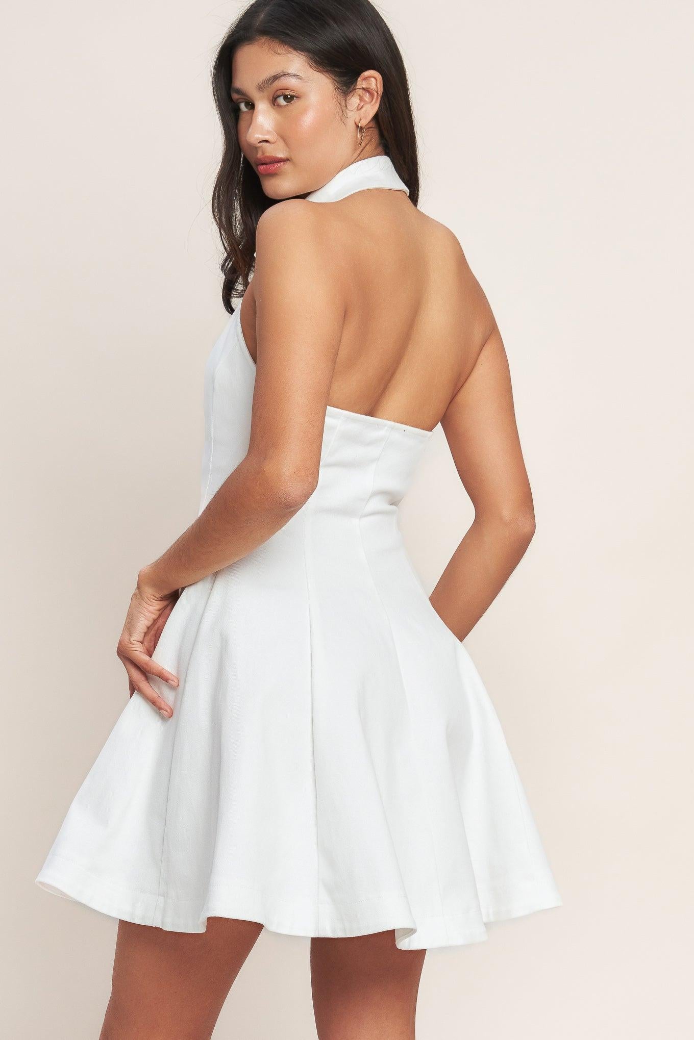 White sleeveless mini dress with a collared neckline, fitted bodice, and gold button front
Details:
Self: 97% Cotton 3% Spandex
Size & Fit
- Model is 5`8" And Wearing Size Small
- Measurements Taken From Size Small
- Approx. Length: 35"