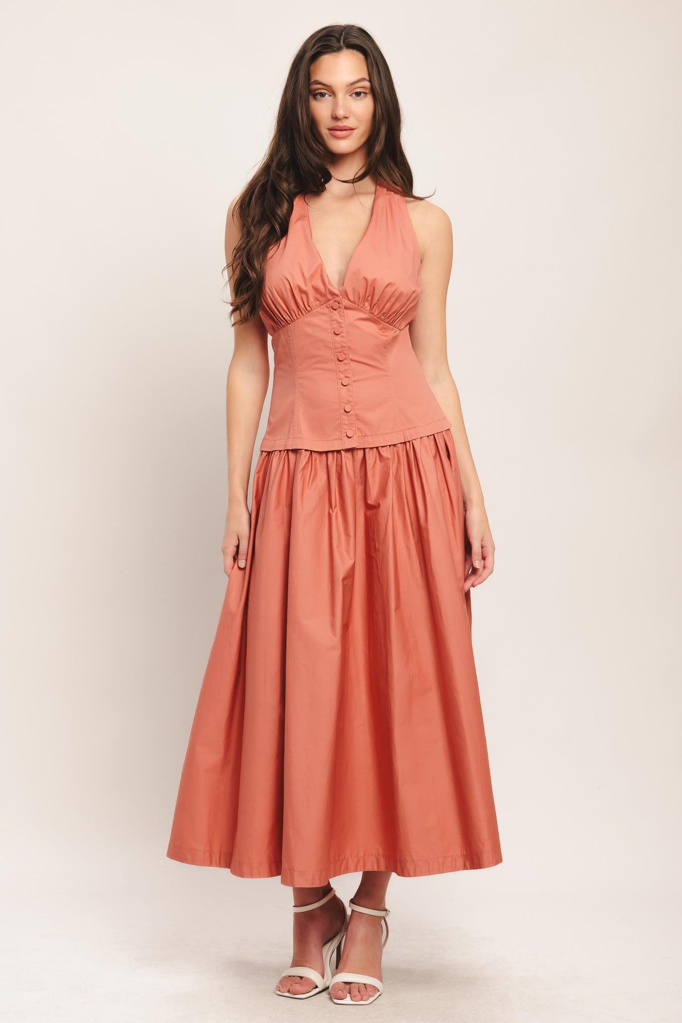 A solid woven midi dress featuring halter neck with back neck button, front button detail, full skirt and back zipper closure
Details:
Self : 100% Cotton
Lining : 100% Polyester
Size & Fit
- Model is 5`8" And Wearing Size Small
- Measurements Taken From Size Small
- Approx. Length: 52"