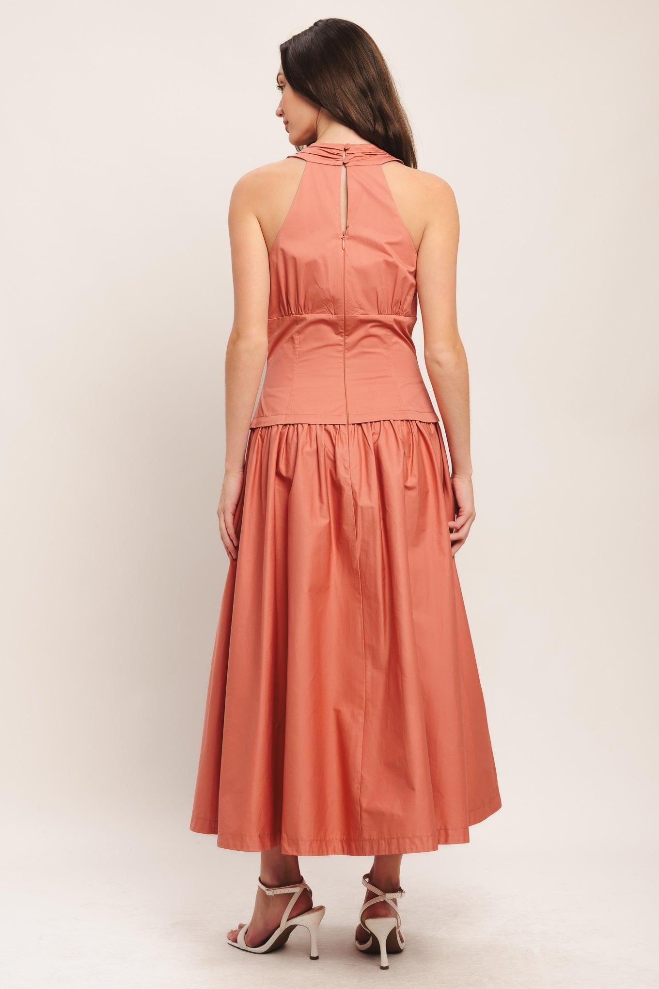 A solid woven midi dress featuring halter neck with back neck button, front button detail, full skirt and back zipper closure
Details:
Self : 100% Cotton
Lining : 100% Polyester
Size & Fit
- Model is 5`8" And Wearing Size Small
- Measurements Taken From Size Small
- Approx. Length: 52"