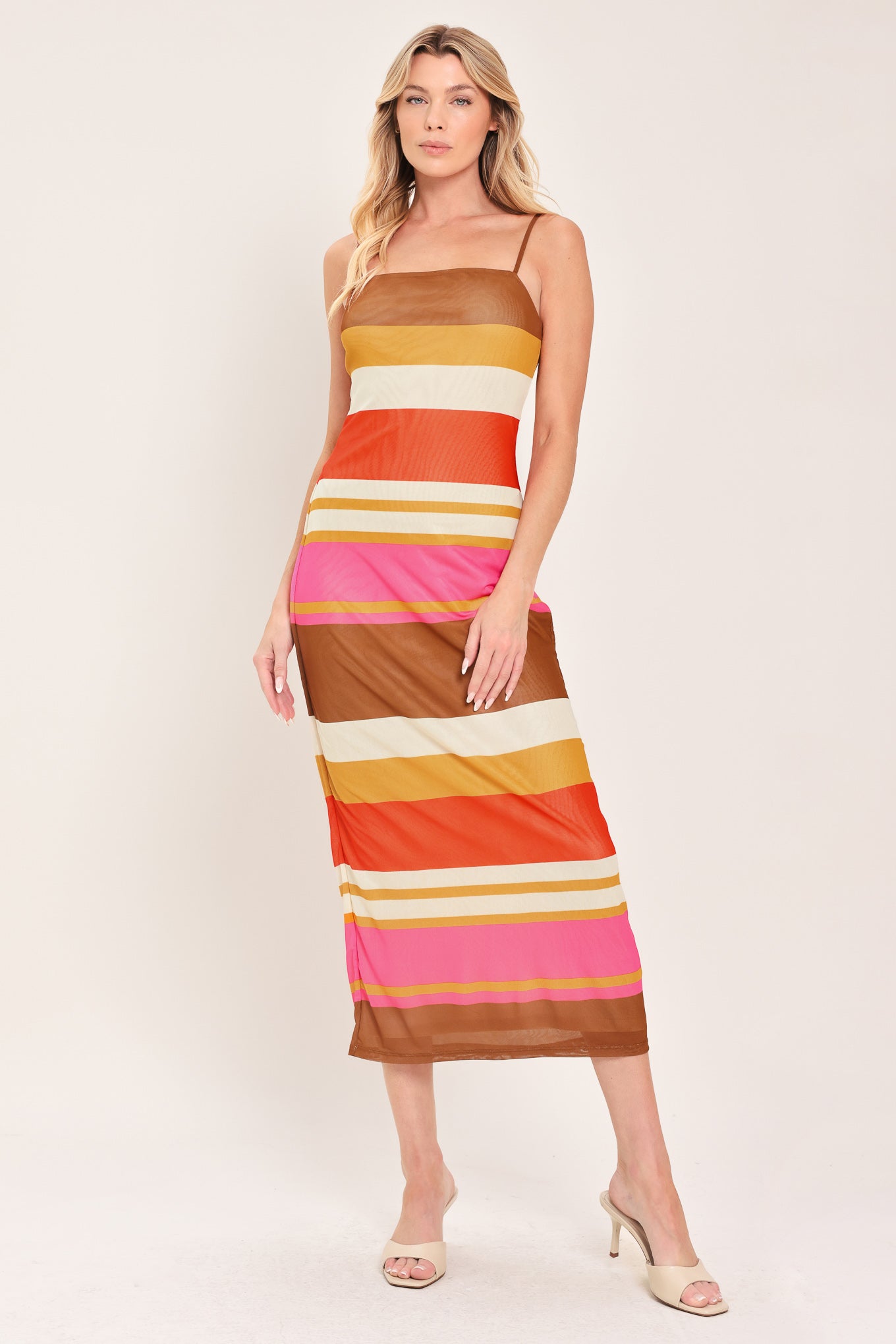 Woman wearing a colorful striped power mesh midi dress | Flying Tomato