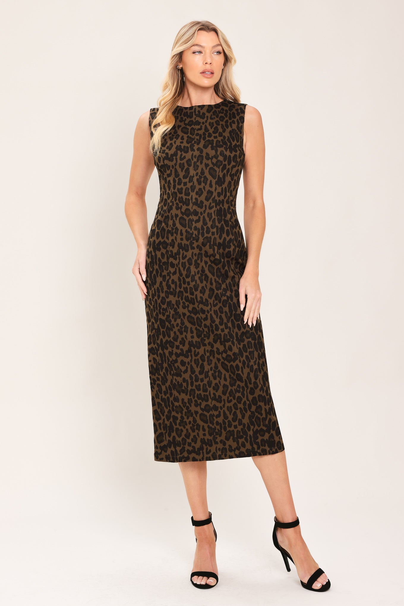 Woman wearing a brown and black leopard print twill midi dress with round neckline, sleeveless, back slit and zipper closure | Flying Tomato