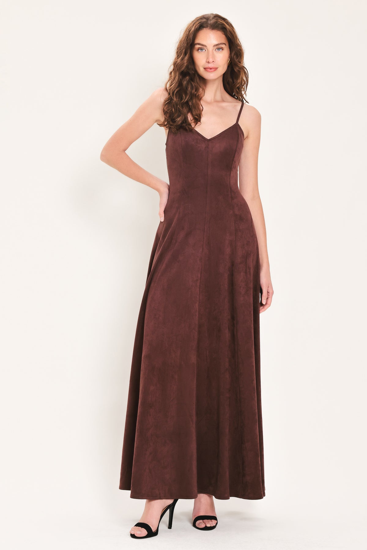 Woman wearing a sleeveless raisin brown suede maxi dress | Flying Tomato