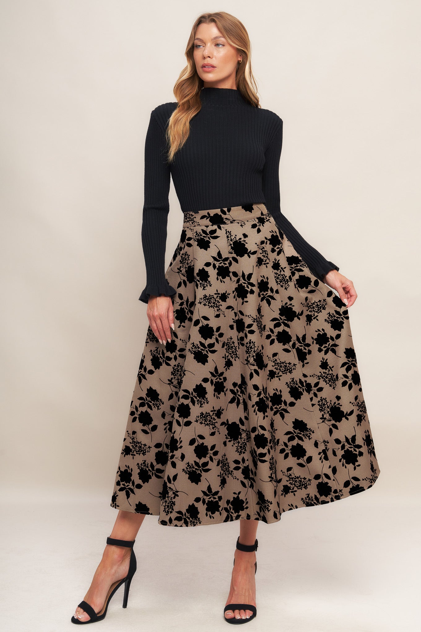 A woven flocking circle skirt with side zipper closure
