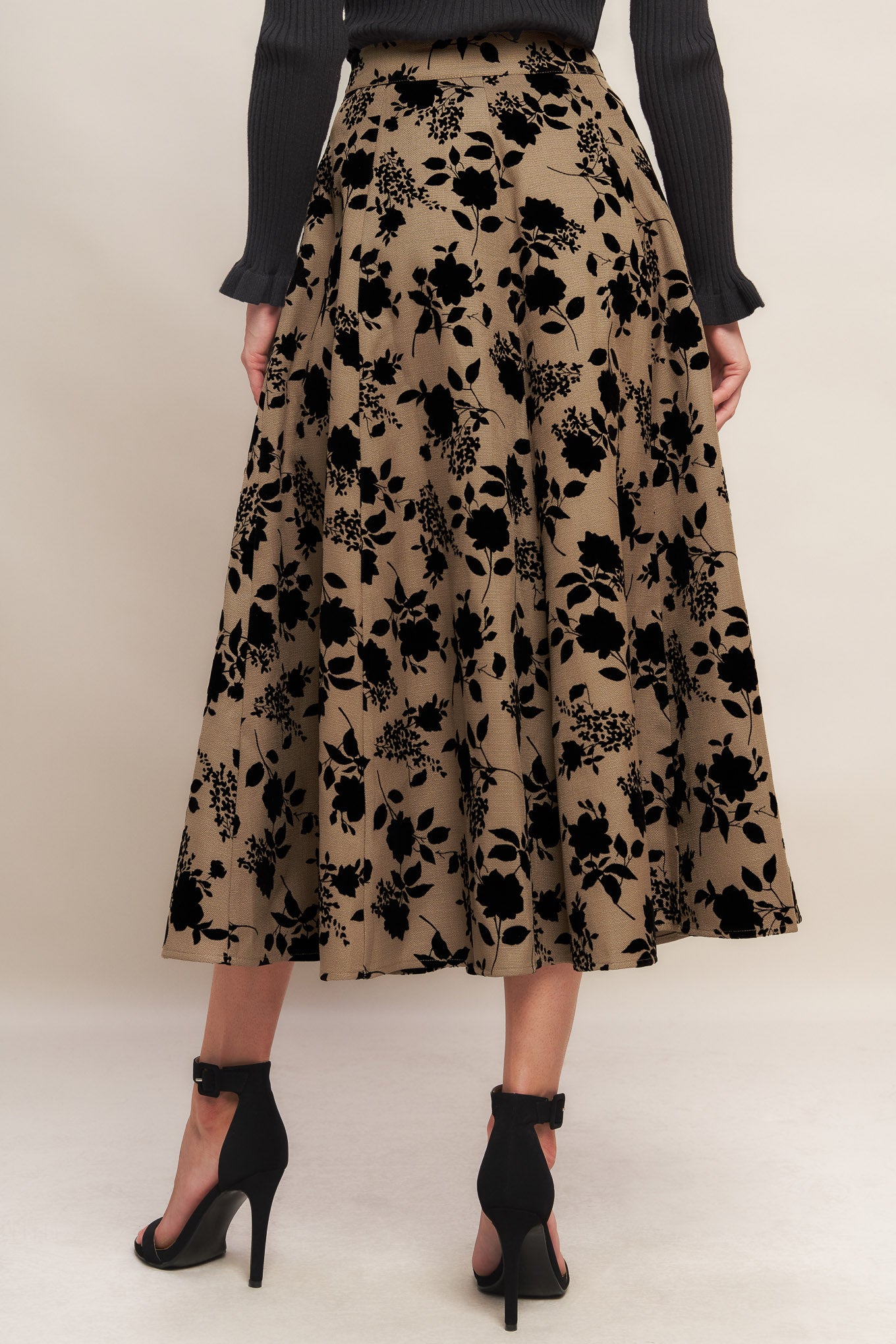 A woven flocking circle skirt with side zipper closure