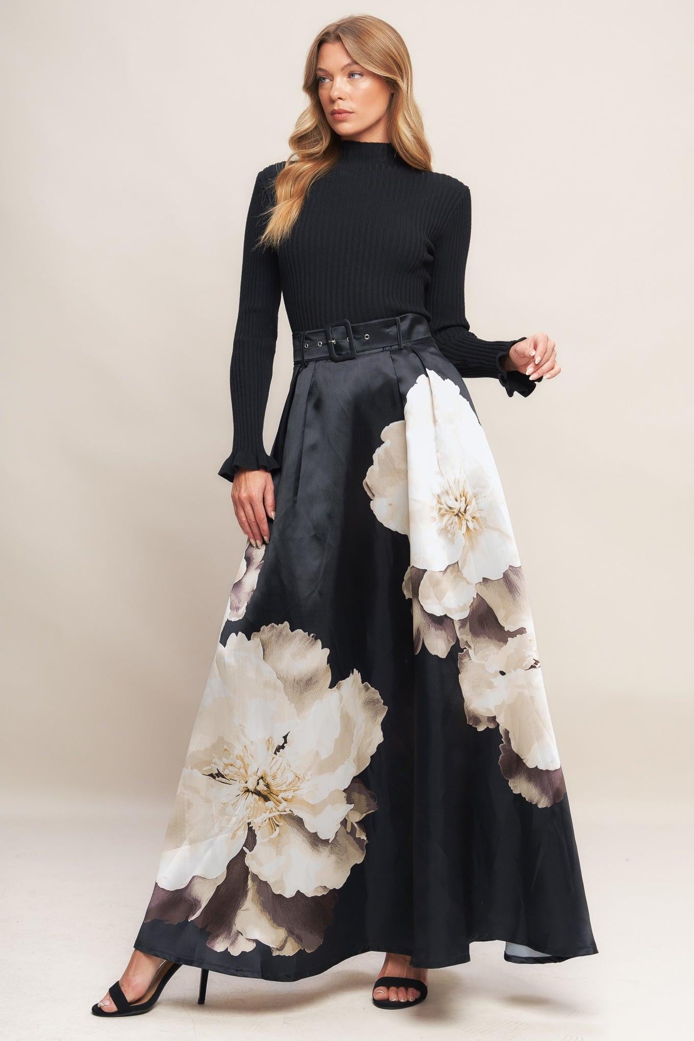 A printed woven maxi skirt with self belt and side zipper closure