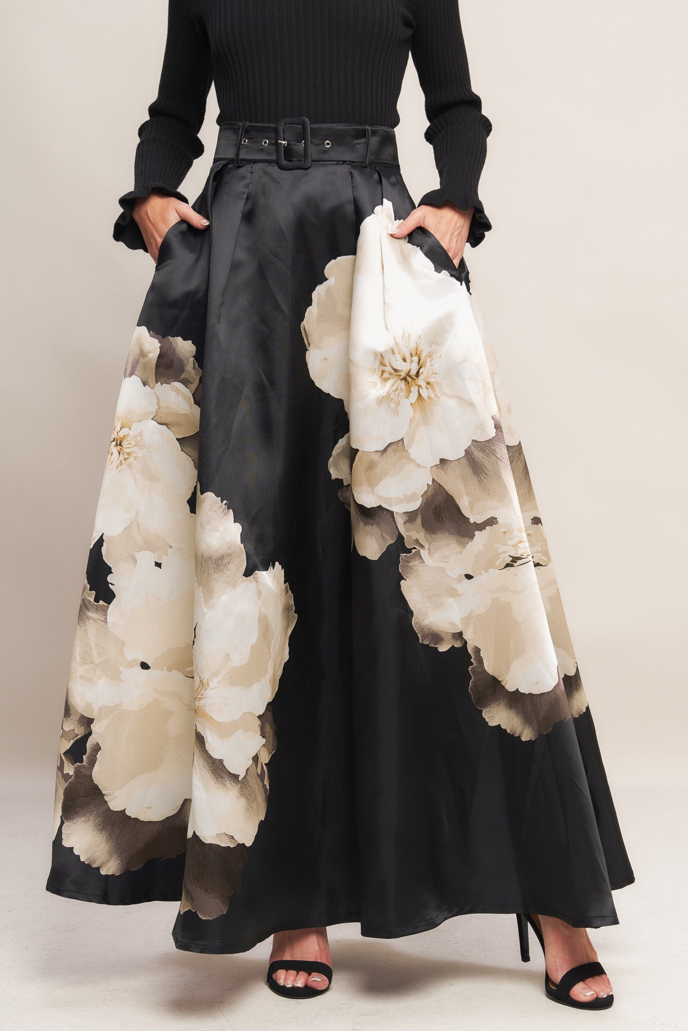 A printed woven maxi skirt with self belt and side zipper closure