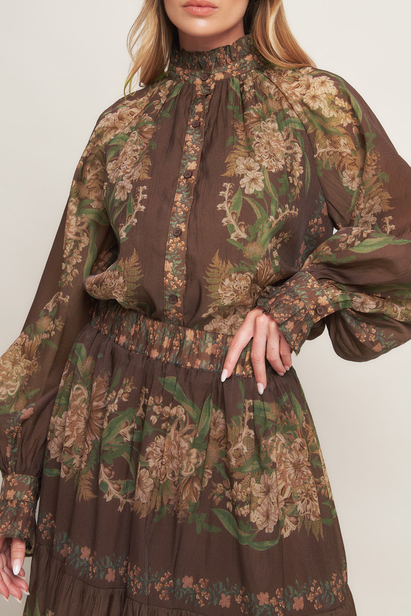 A printed woven maxi skirt featuring elasticized waist and tiers