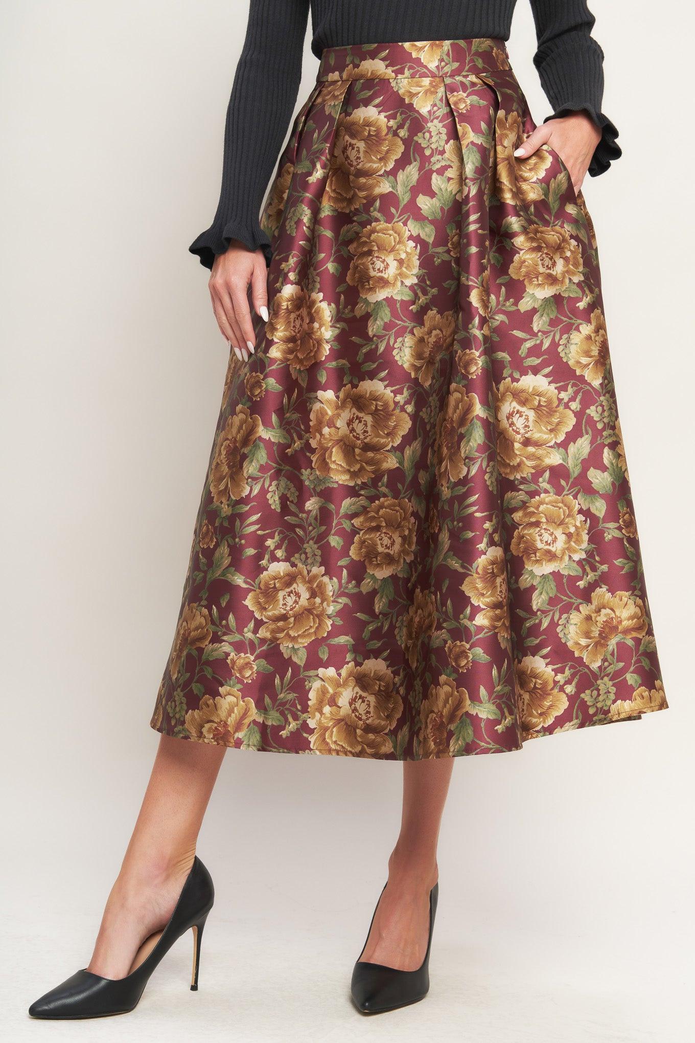 A brown floral printed woven full midi skirt with side zipper closure