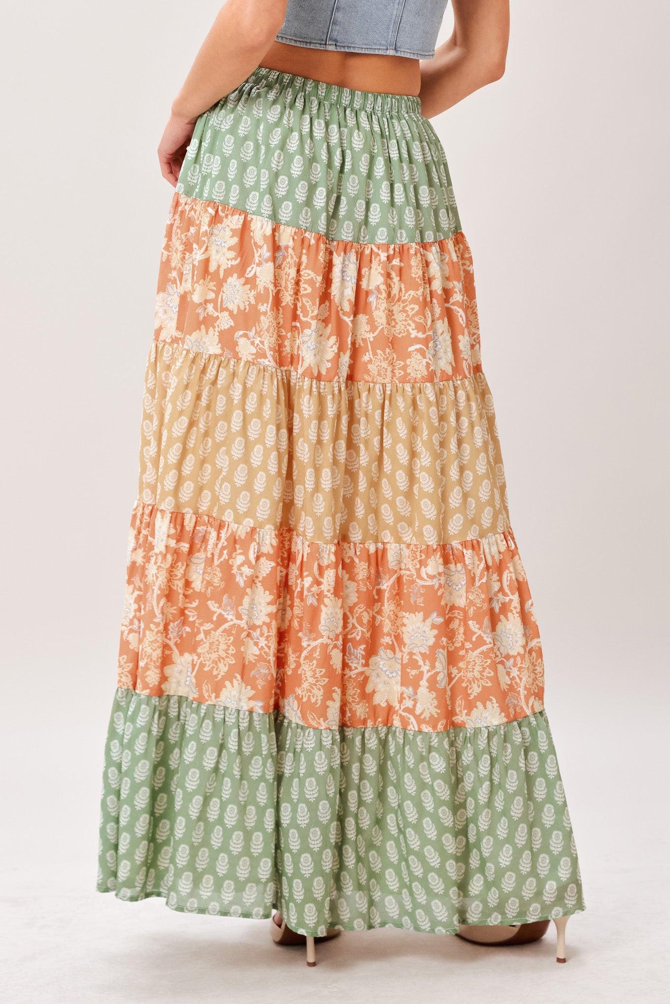 A mix print midi prairie skirt with elastic waist and tie/tassel