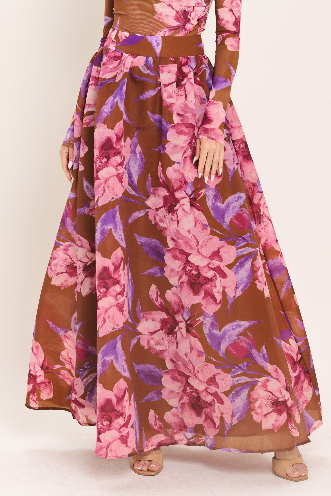Woman wearing a brown floral maxi skirt with pink and purple flowers | Flying Tomato