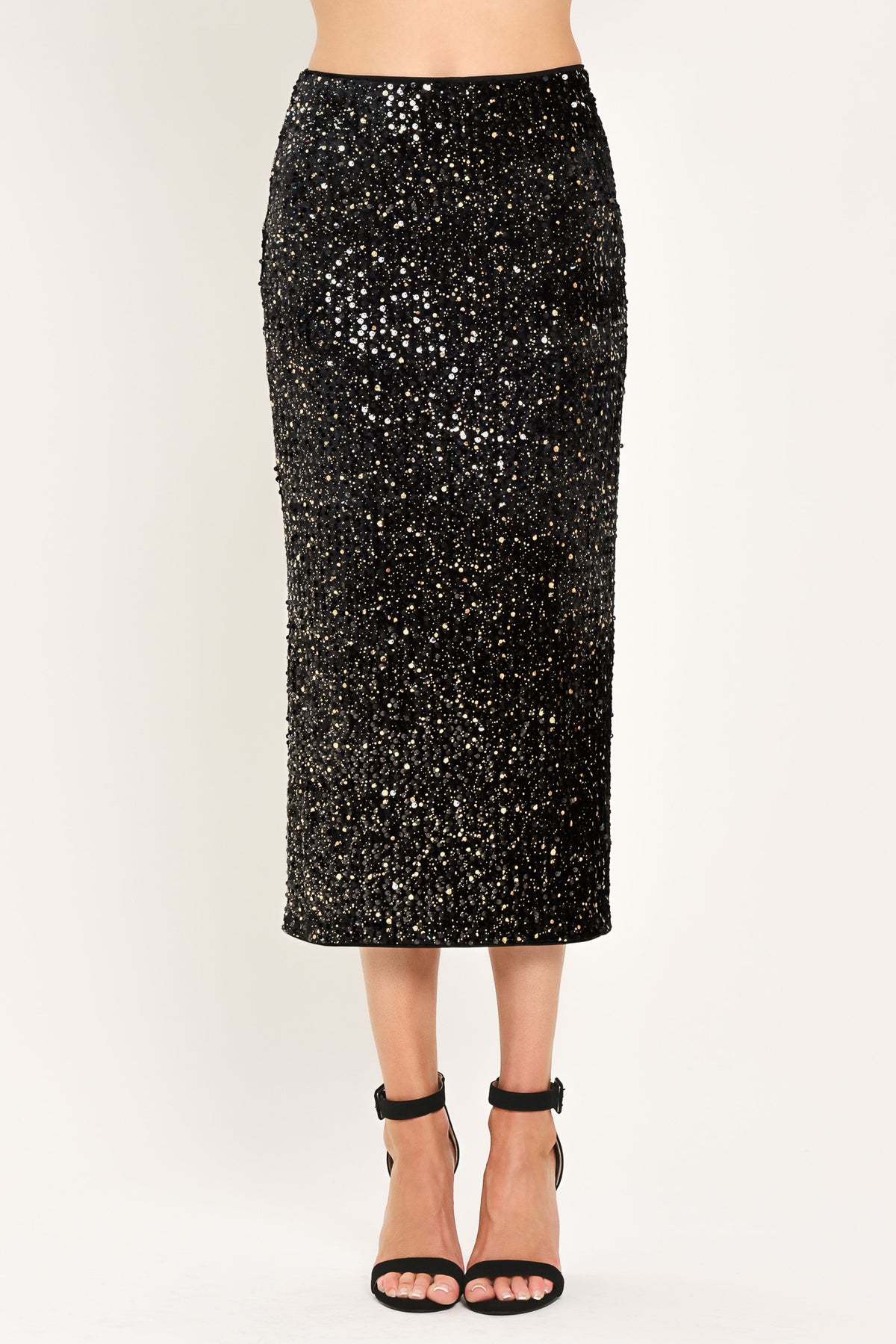 A black sequined midi skirt worn by a model | Flying Tomato