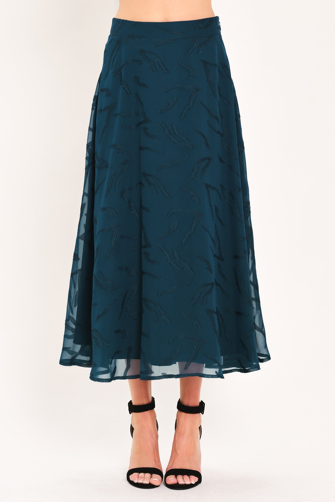 A dark teal blue midi skirt with a subtle tonal leaf pattern | Flying Tomato