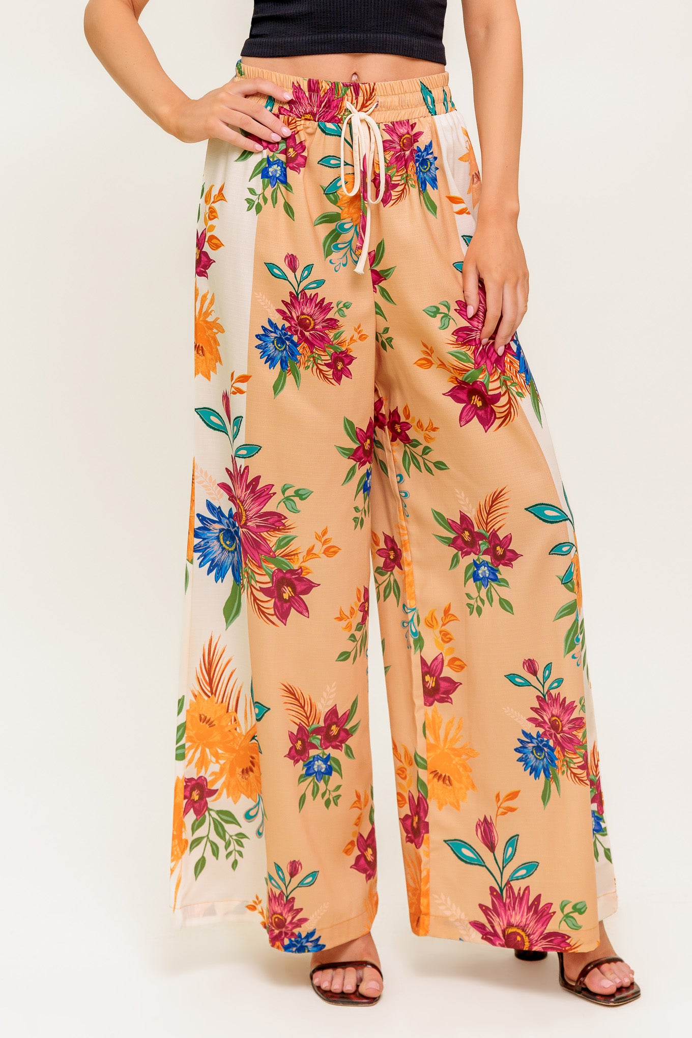 A printed woven pant with elasticized waist and tie