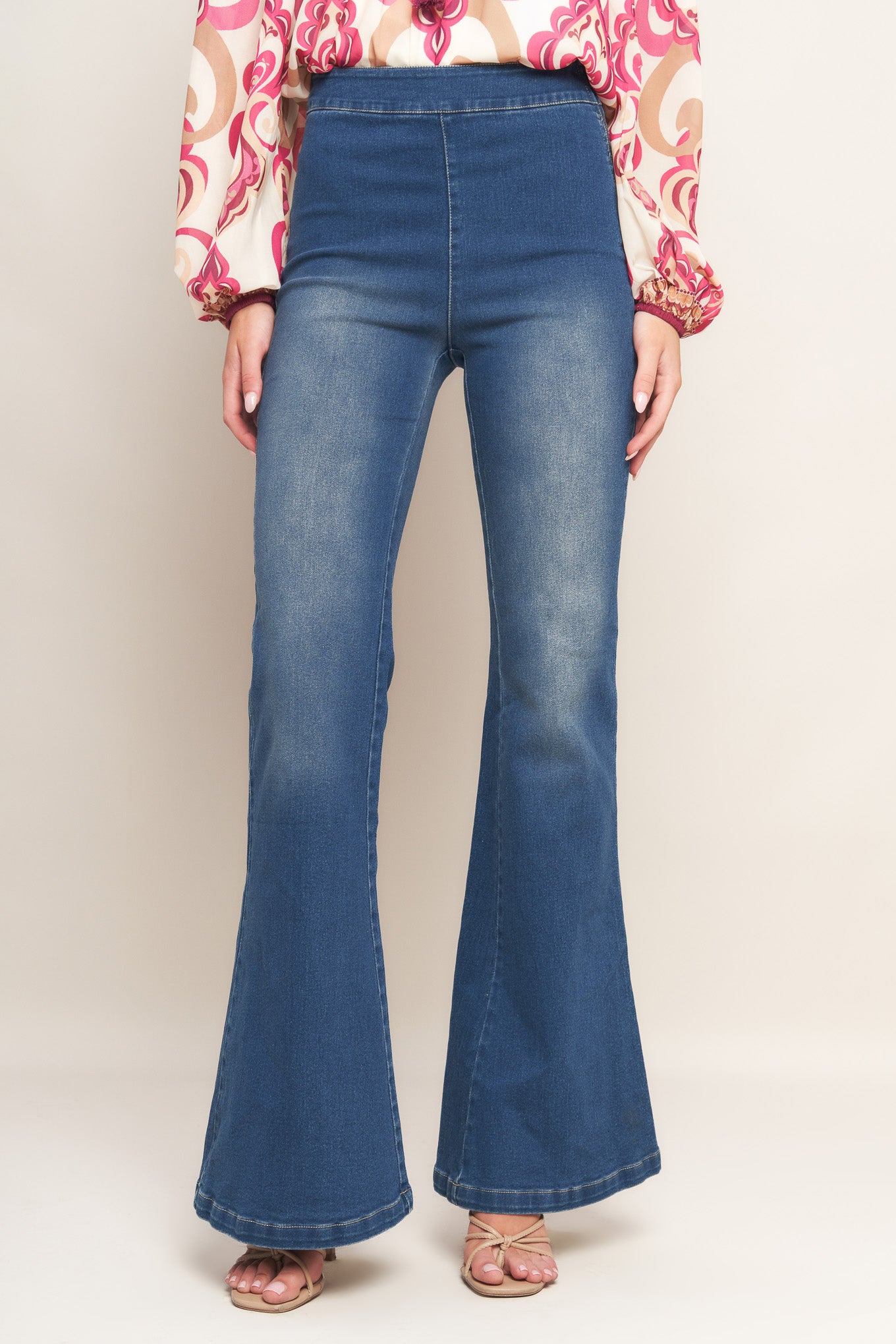 A washed denim with flare bottom and side zipper closure