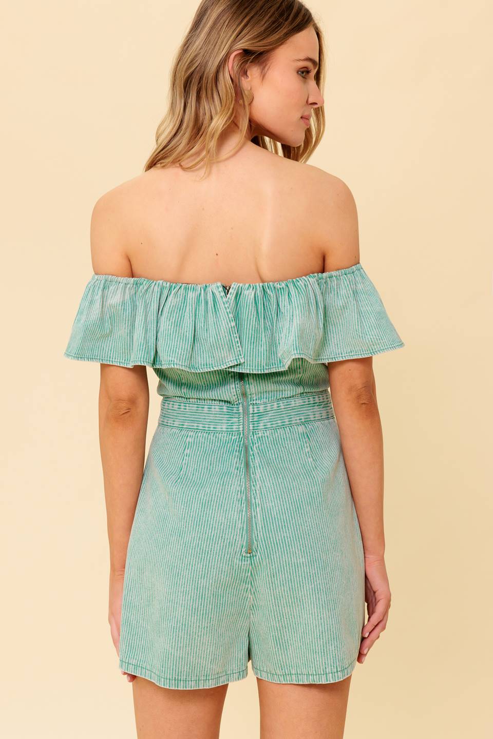 A washed light green striped woven romper featuring off shoulder neckline, flounce, skort with back zipper closure