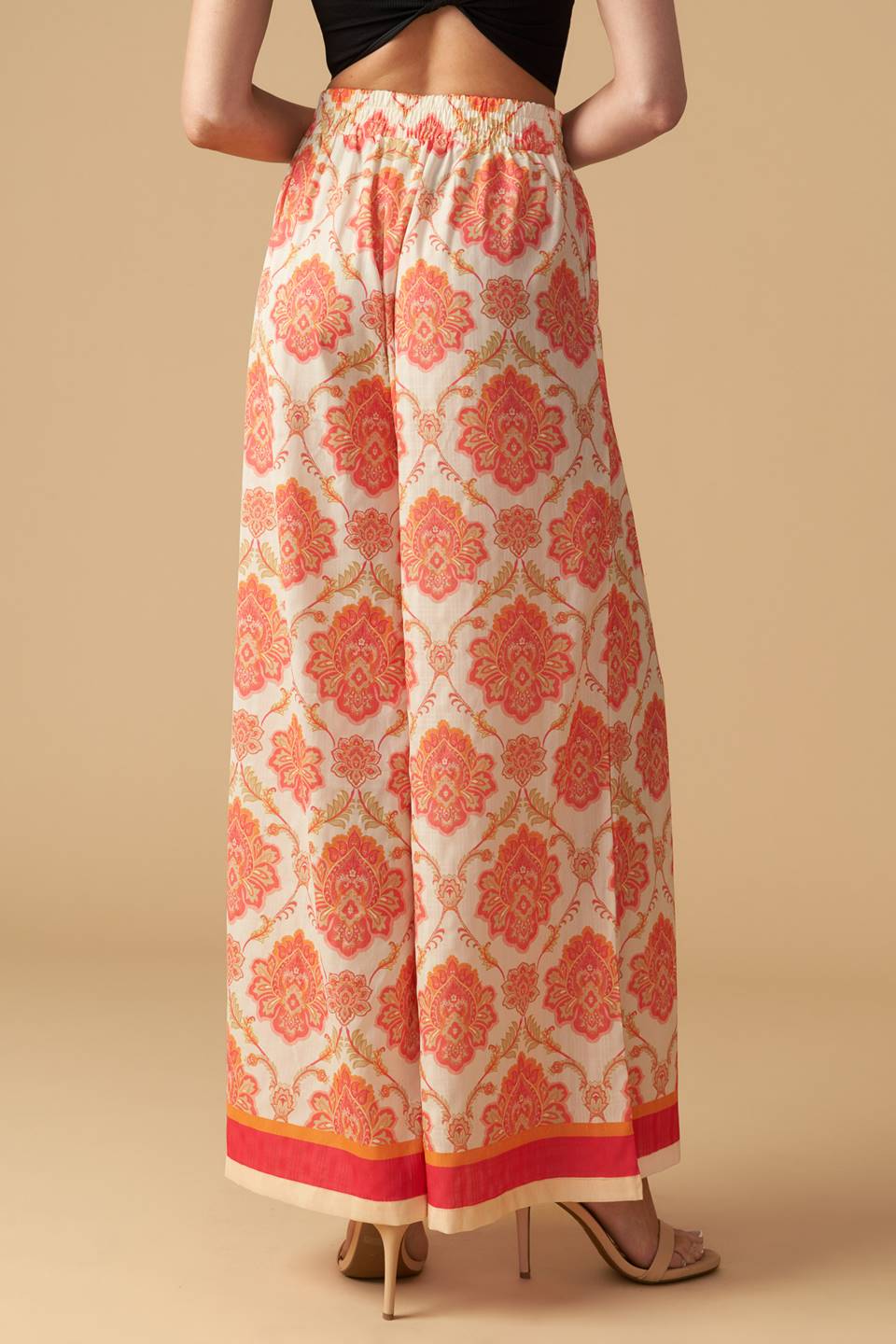 A printed woven wide-leg pant with an elasticized waistband. Matching top INTO THE NIGHT WOVEN TOP