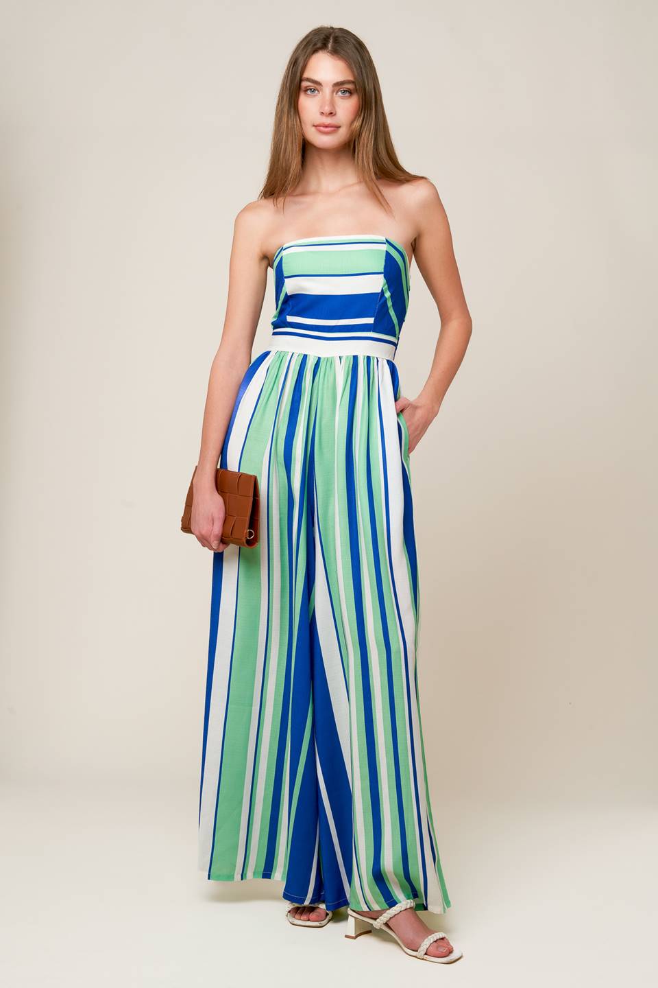 A printed woven jumpsuit featuring strapless, wide leg and smocked back bodice
Details:
Self : 100% Polyester
Lining : 100% Polyester
Size & Fit
- Model is 5`8" And Wearing Size Small
- Measurements Taken From Size Small
- Approx. Length: 51"