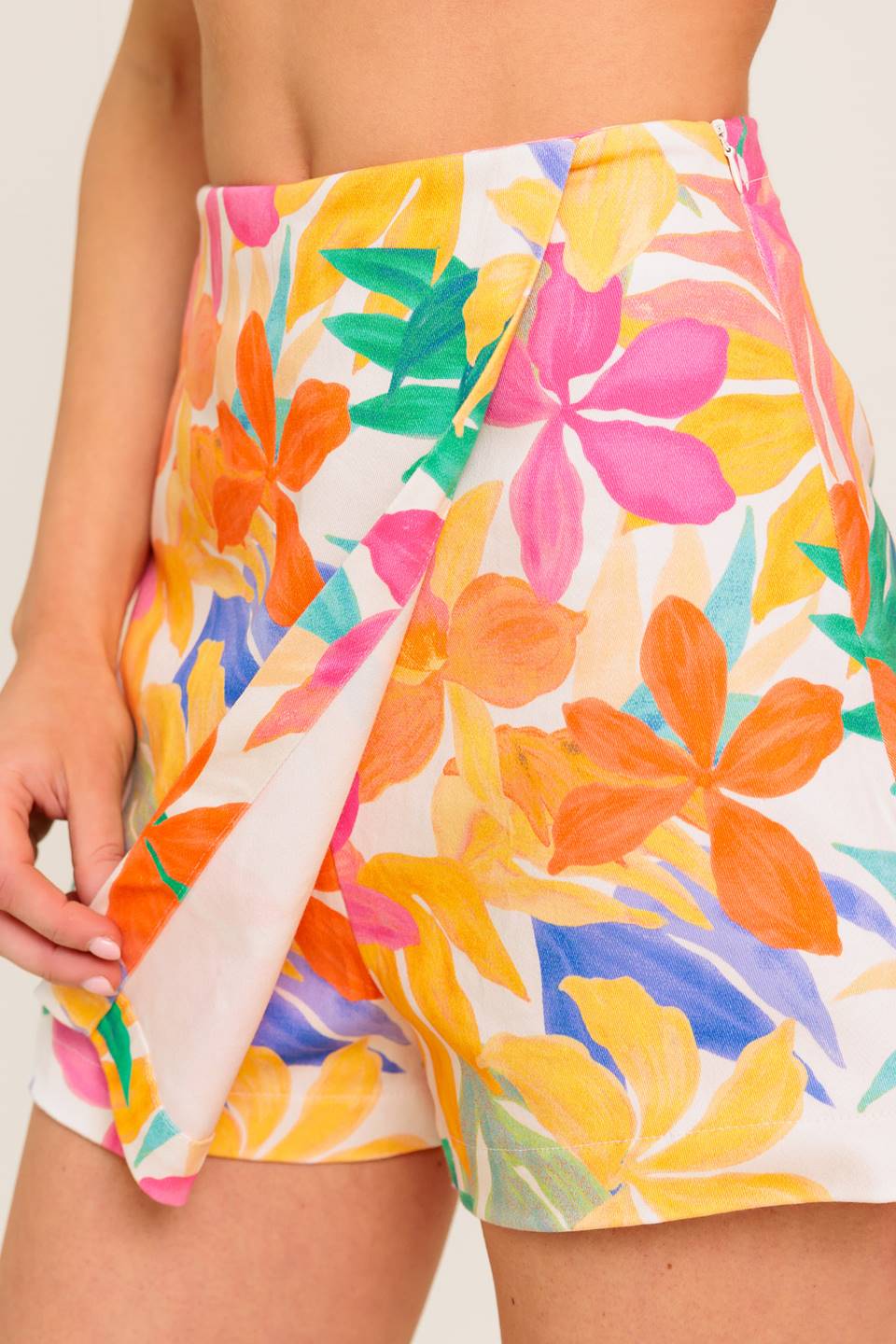 A printed woven skort with side zipper closure.