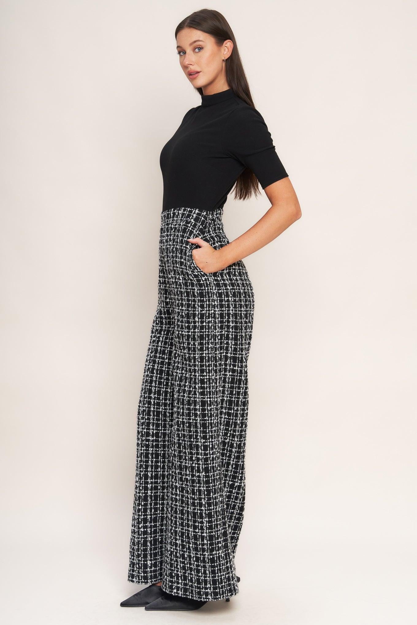 A ribbed knit top and tweed pant jumpsuit featuring mock neckline, short sleeve, side leg and back zipper closure