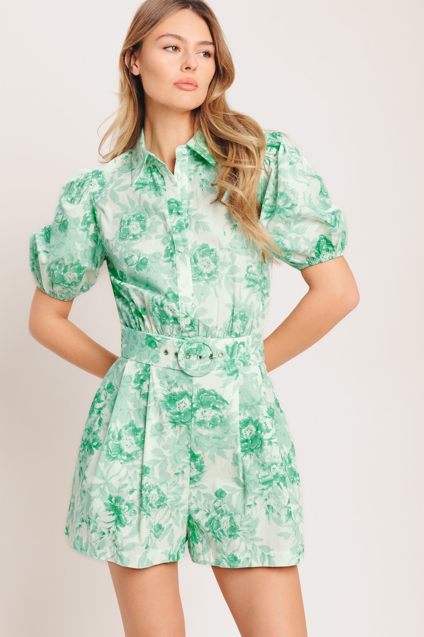 A printed woven romper featuring short puff sleeve, button down detail, front pleats, side pocket and self belt and elasticized back waistband
Details:
Self: 100% Cotton
Size & Fit
-Model is 5`8" And Wearing Size Small
-Measurements Taken From Size Small
-Approx. Length: 33"