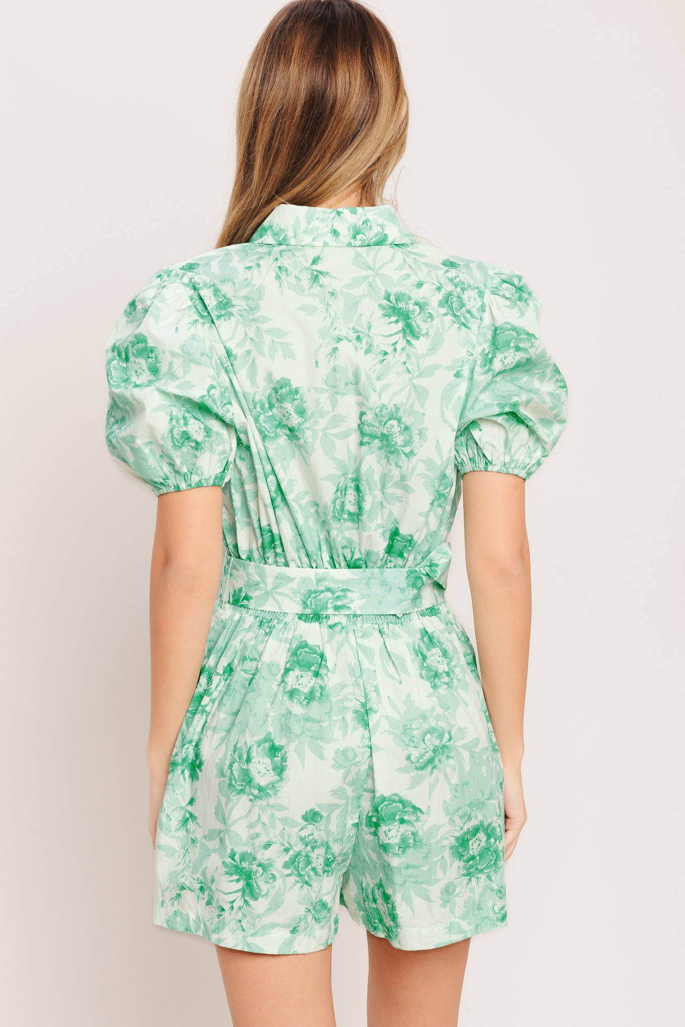 A printed woven romper featuring short puff sleeve, button down detail, front pleats, side pocket and self belt and elasticized back waistband
Details:
Self: 100% Cotton
Size & Fit
-Model is 5`8" And Wearing Size Small
-Measurements Taken From Size Small
-Approx. Length: 33"