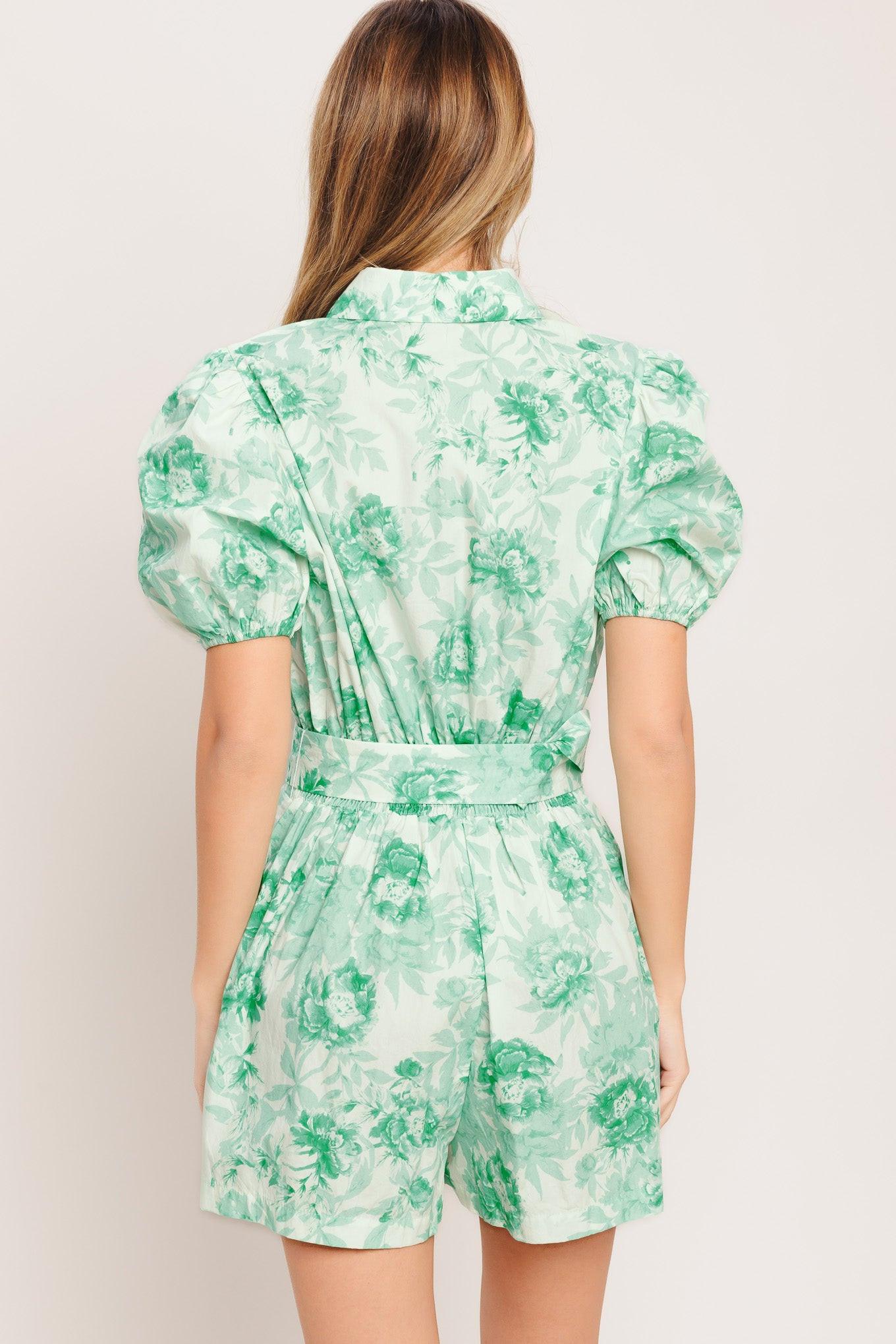A printed woven romper featuring short puff sleeve, button down detail, front pleats, side pocket and self belt and elasticized back waistband
Details:
Self: 100% Cotton
Size & Fit
-Model is 5`8" And Wearing Size Small
-Measurements Taken From Size Small
-Approx. Length: 33"