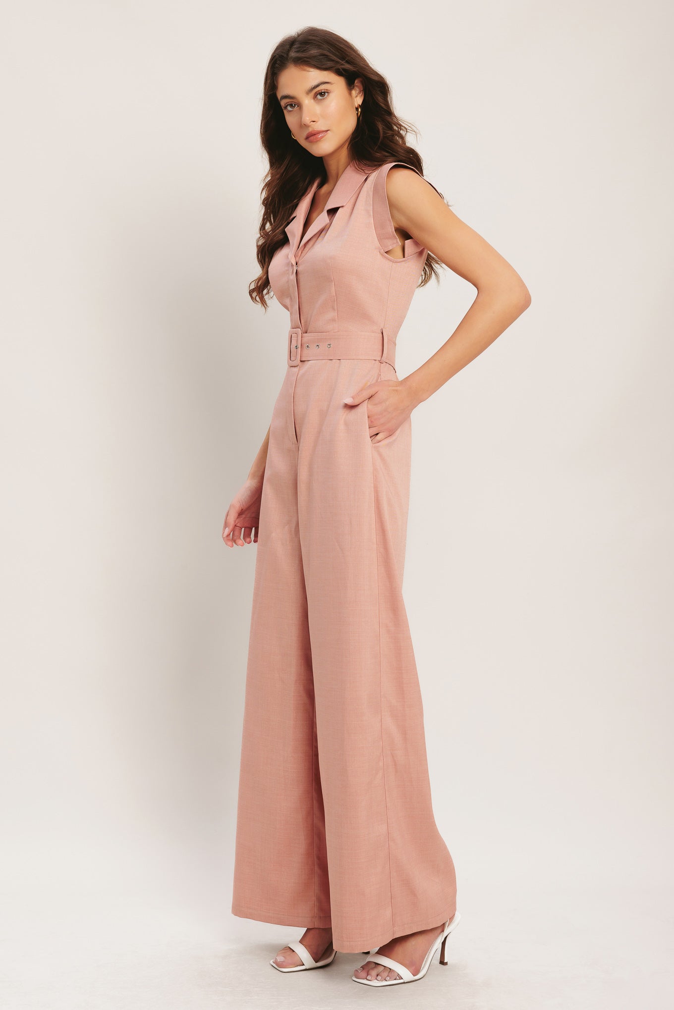 A solid woven jumpsuit featuring collar, short sleeve, front button zipper closure, self belt, side pocket and wide leg
Details:
Self : 95% Polyester 5% Spandex
Size & Fit
- Model is 5`8" And Wearing Size Small
- Measurements Taken From Size Small
- Approx. Length: 60"