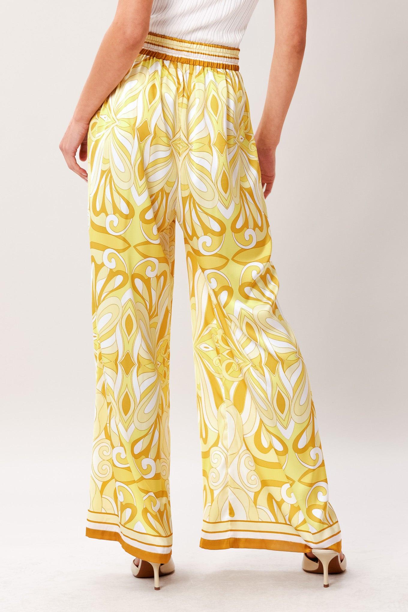 A printed woven pant with elastic waist with tie and wide leg