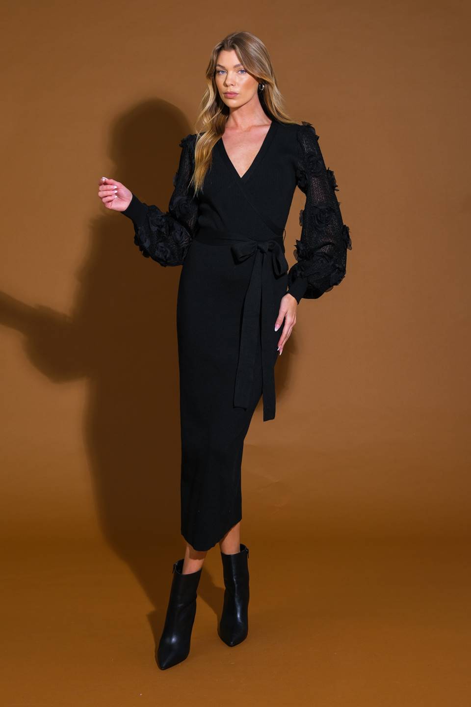 A knit sweater midi dress featuring surplice neckline, contrasting long sleeve and self sash tie
Details:
Self : 70% Viscose 30% Nylon
Contrast: 100% Polyester
Size & Fit
- Model is 5`8" And Wearing Size Small
- Measurements Taken From Size Small
- Approx. Length: 51"