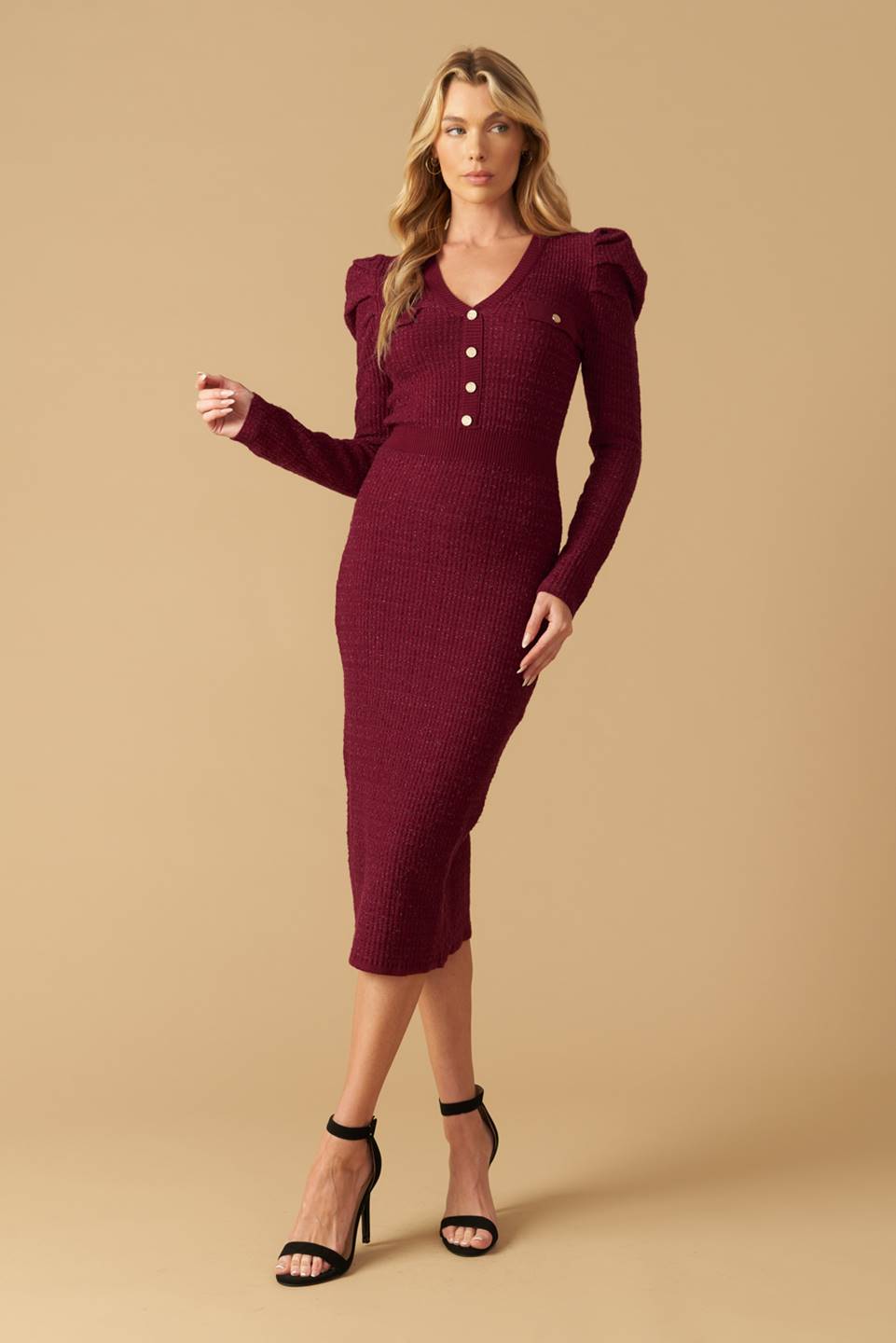 A sweater knit midi dress featuring V neckline, long puff sleeve and front button detail
Details:
Self : 45% Nylon 35% Viscose 20% Metallic
Size & Fit
- Model is 5`8" And Wearing Size Small
- Measurements Taken From Size Small
- Approx. Length: 47"
